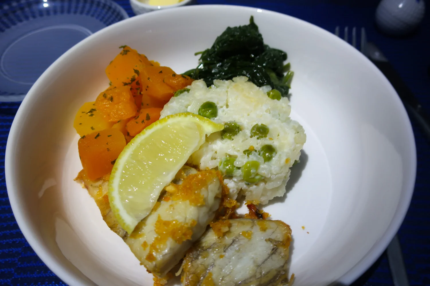 Hapuka Fish With Pea Risotto - United Business Class Sydney to Houston Photo: Calvin Wood