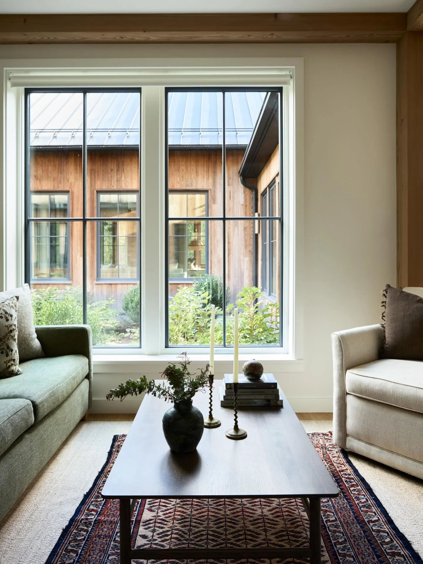 Opposite the large great room and kitchen, this den provides a cozy retreat for movies, games and serious couch forts #thayerdesignstudio 
#thoughtformsbuilders