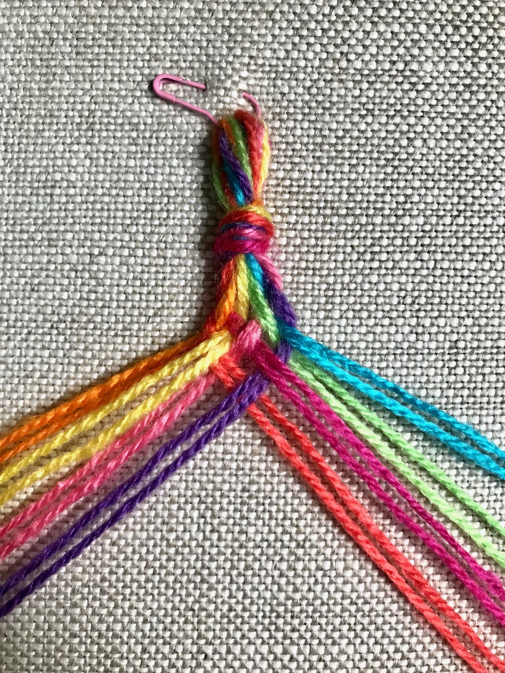 10. Pull to tighten the weave and join the thread just used to the left group, bringing it back to 4 on each side again.