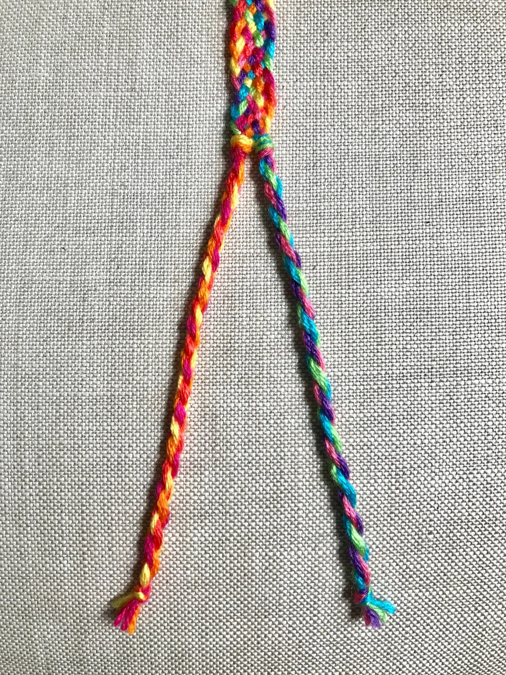 12. Repeat steps 19-24 from the Rainbow Chevron Bracelet to create the two rope ties.
