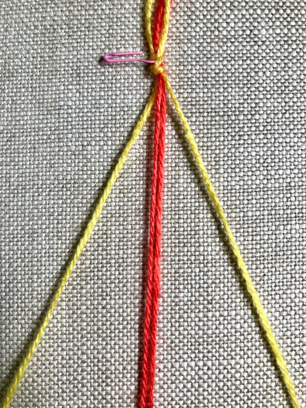 2. Separate strands so the there is one strand to the left and one strand to the right of the two center strands.