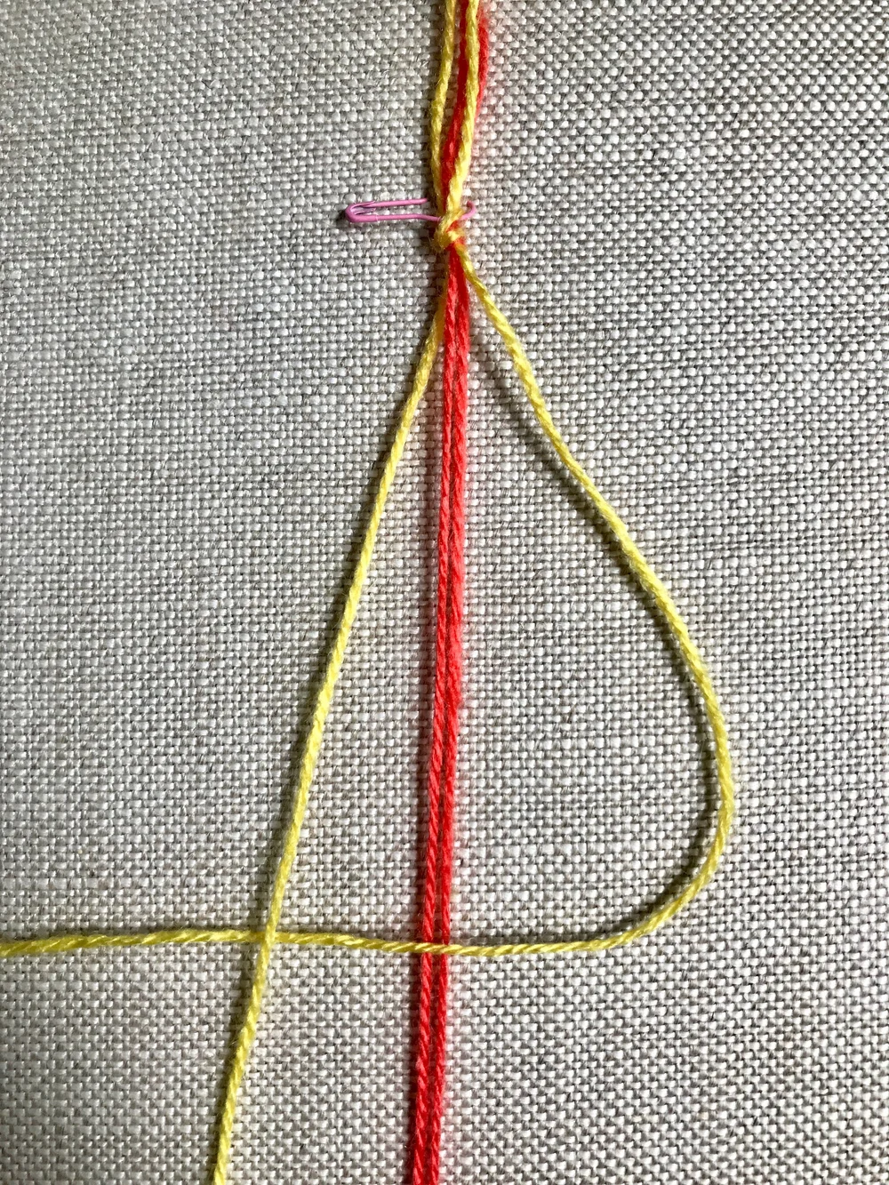 3. Weave right most thread OVER the two center threads and UNDER the left most thread.