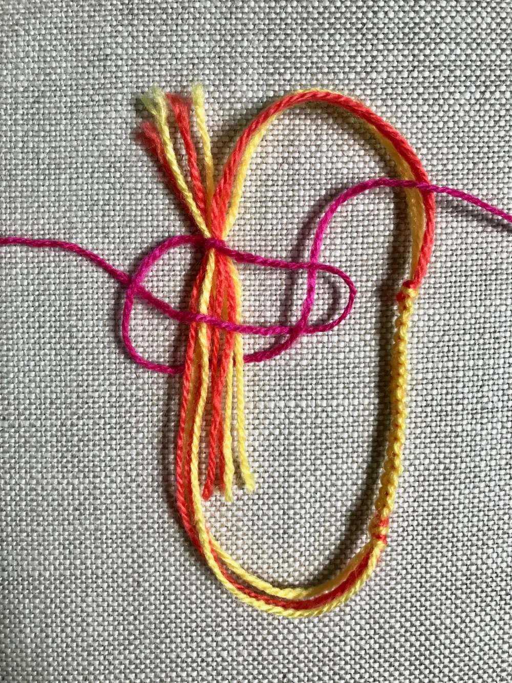 15. Then weave the left most thread UNDER the center bundle and OVER the right most thread.