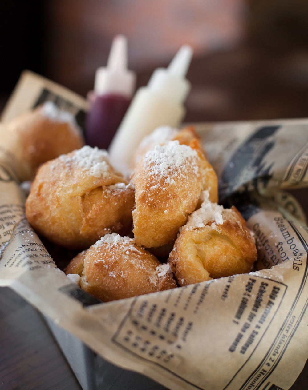 Food_photography_Beignet_Dipping_Sauce_Newspaper_Plating_French_Pastery_Powdered_Sugar.jpg