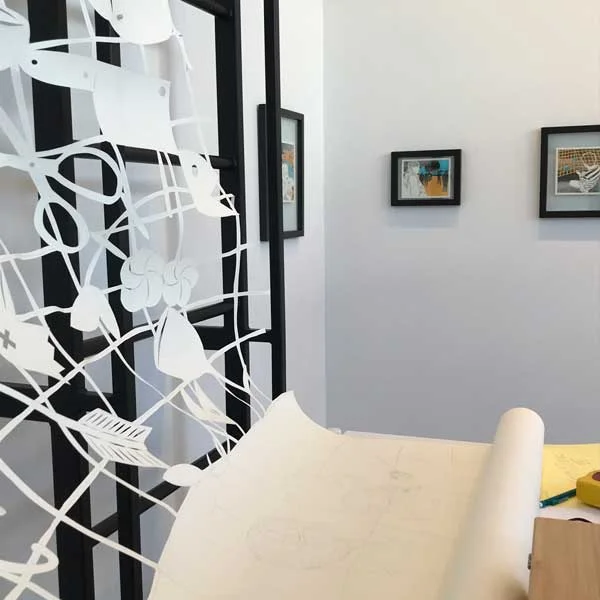 Cambodia-based papercut artist, Lauren Iida created an installation as she worked in an open-studio setting. Iida invited the public to answer the question, “What object reminds you of home?” Over the course of the exhibition, Iida cut these objects into a 40 foot paper net installed in the gallery.