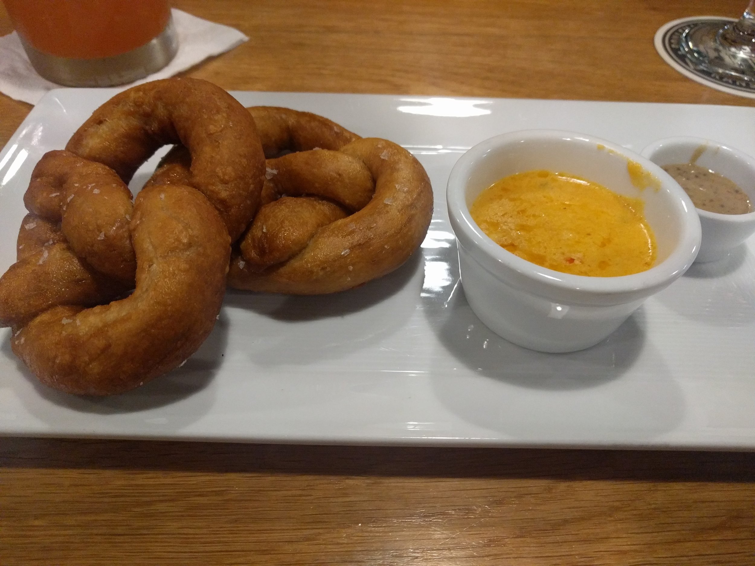 A cheese sauce is incorrectly made or reheated when it breaks into fats and liquids. Serious Eats Food Lab taught me all about it. 