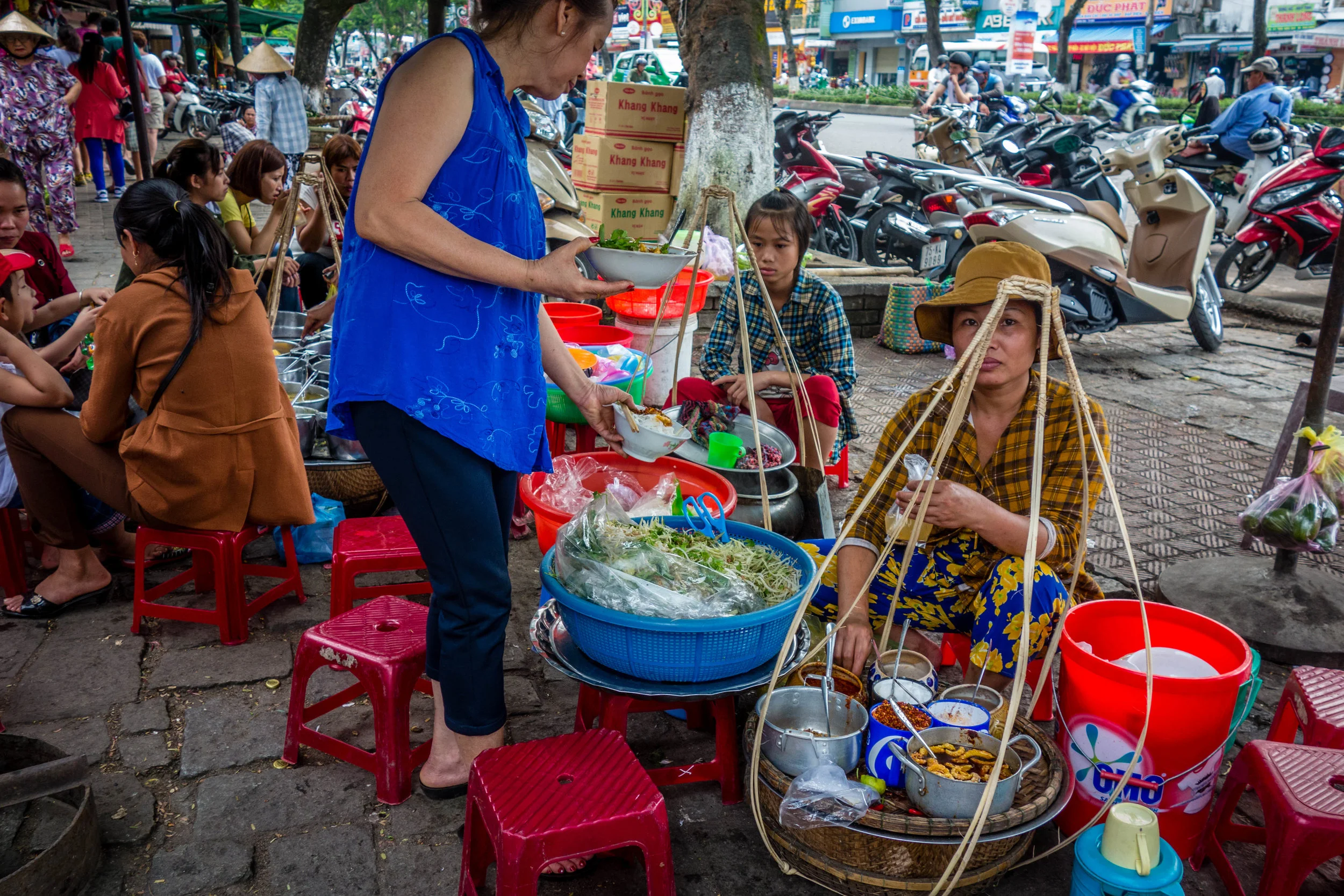 Soup ladies outside the market in Hue, Vietnam