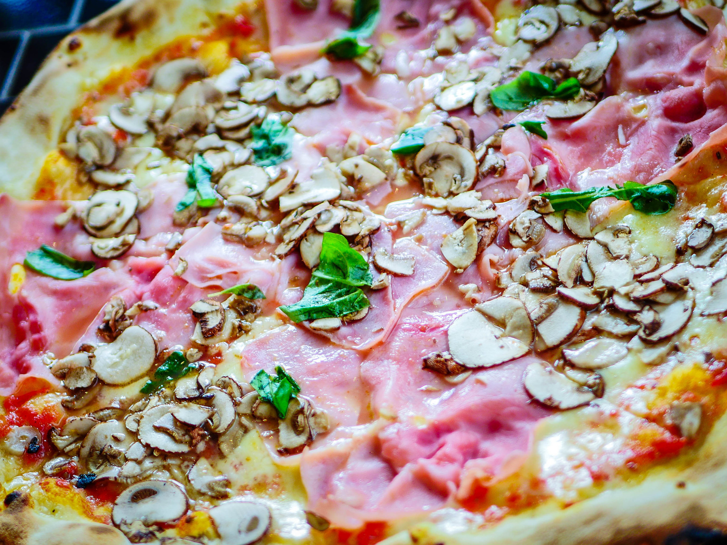 Mushroom, ham, and basil pizza.