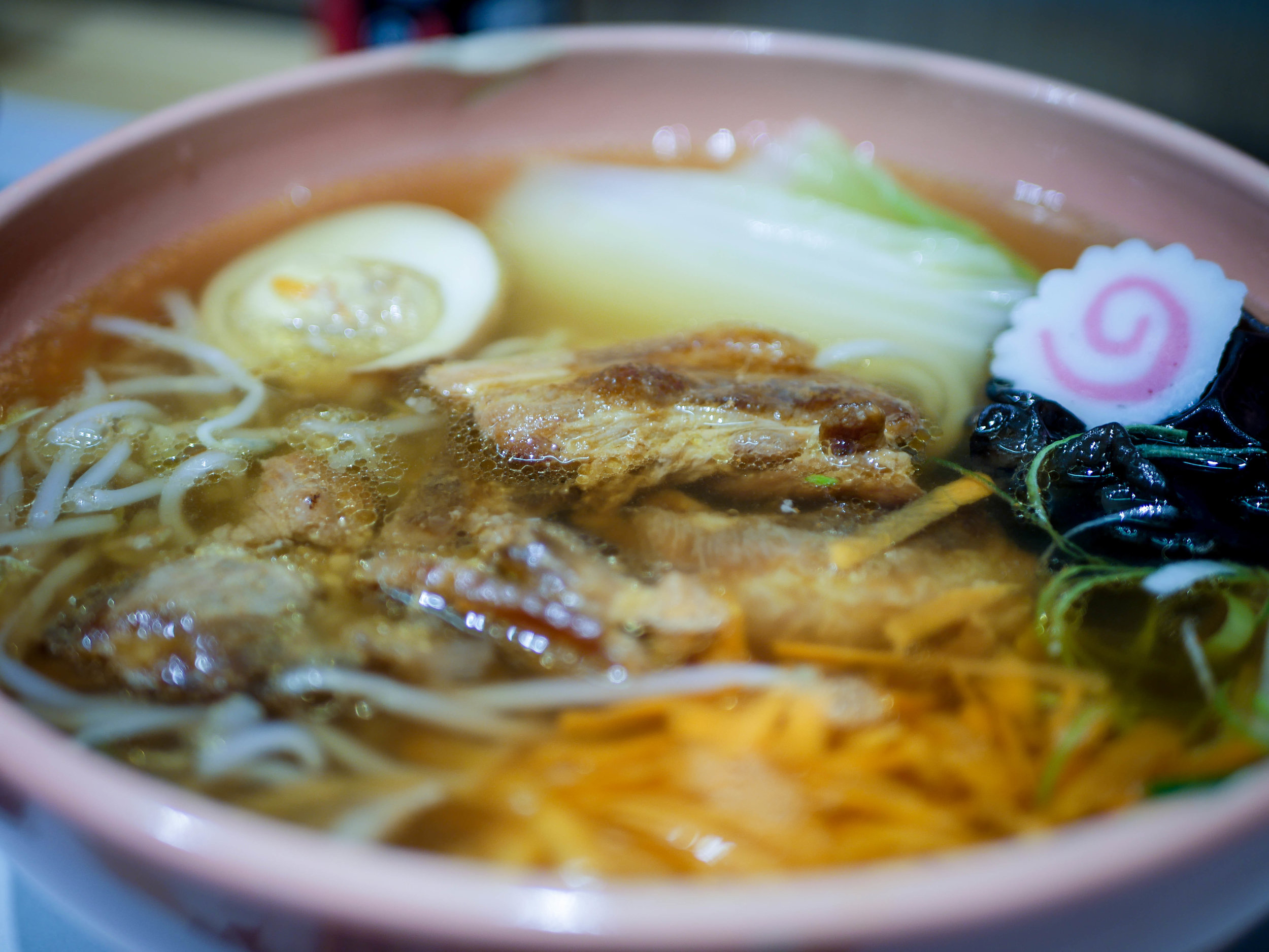 Pork based soup, noodle, chashu, egg, carrot, seasonal vegetables, naruto, shallot, wood ear mushroom, bean sprouts.