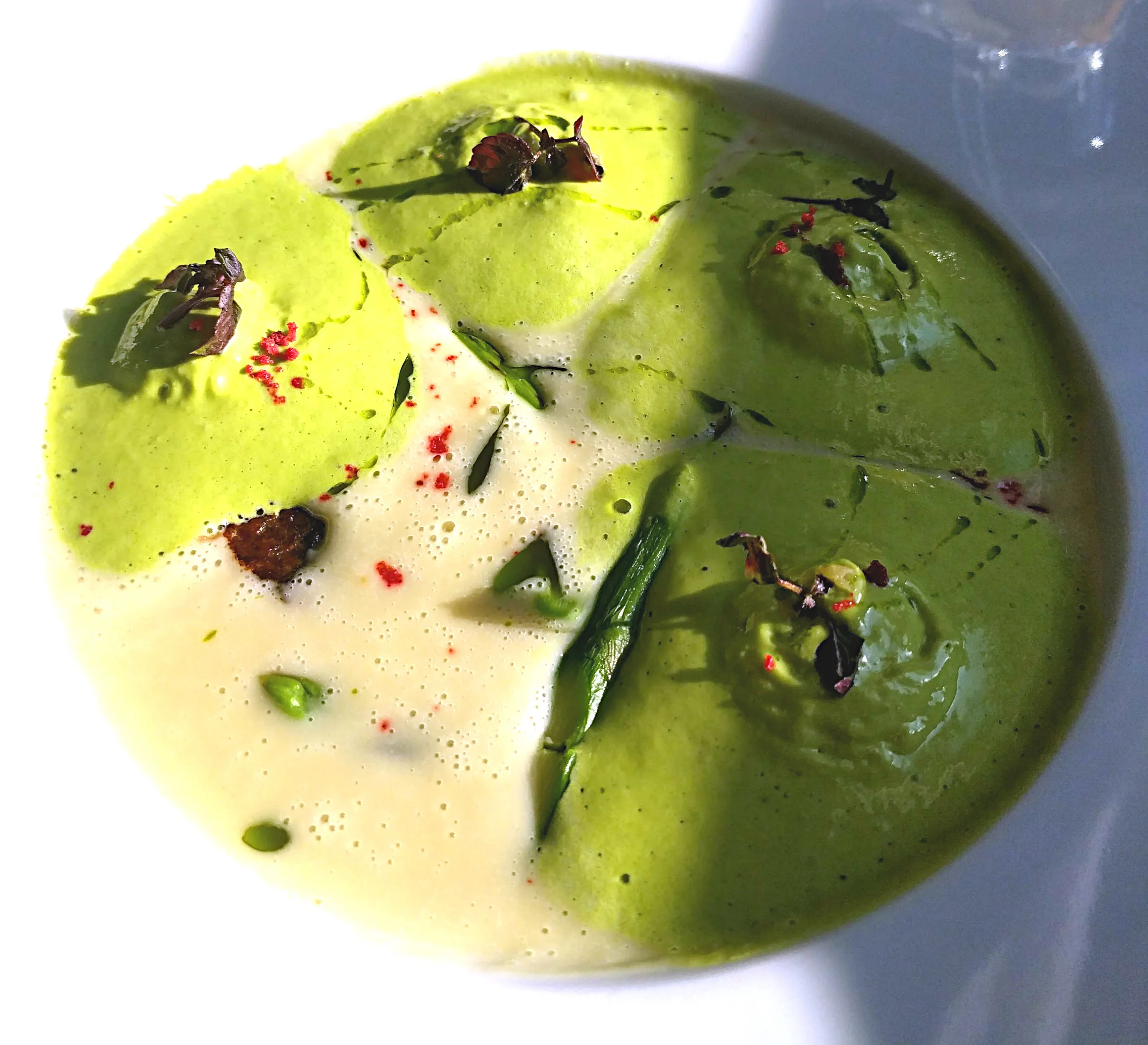 Cream of asparagus soup with braised beef cheeks.