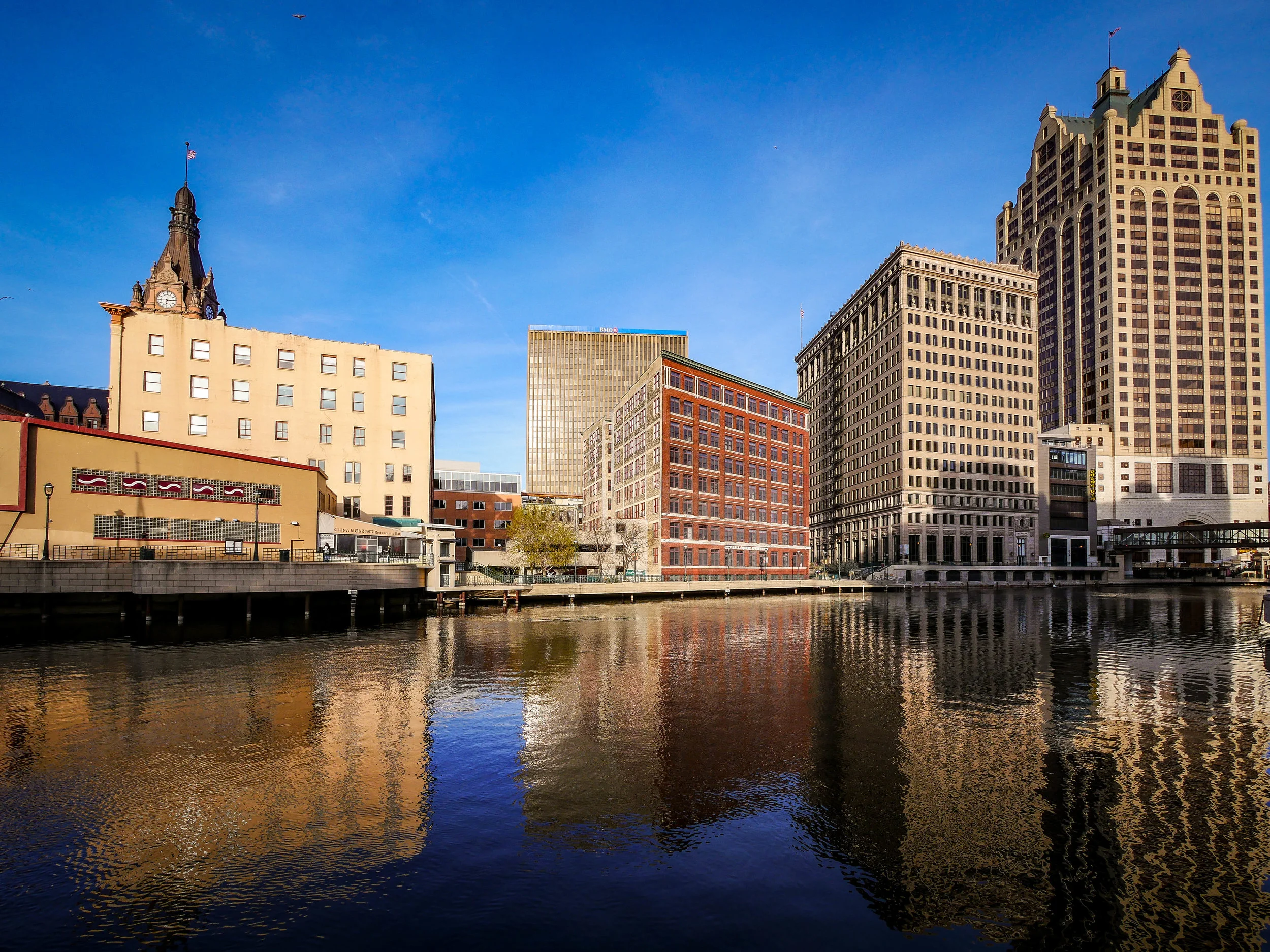 City Hall Clock Tower in the distance and reflections of buildings on the water. Couldn't ask for a more beautiful spring day. 