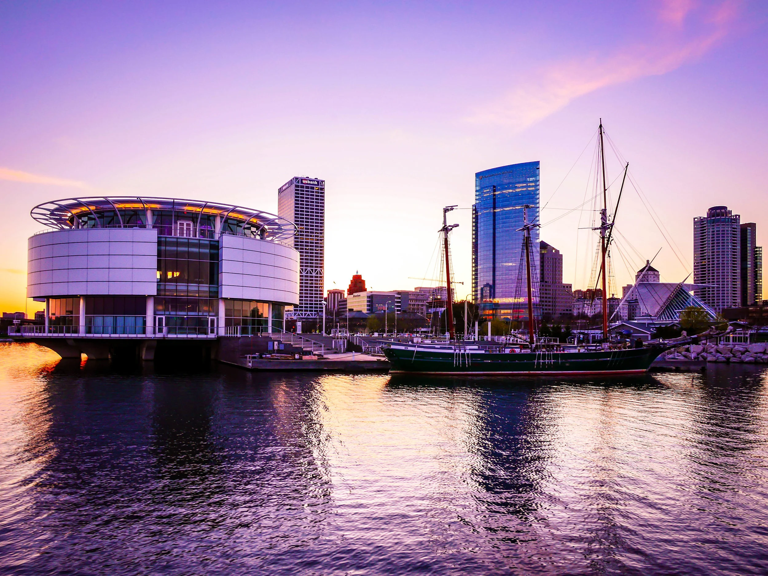 Discovery World and the Denis Sullivan in the setting sun. 