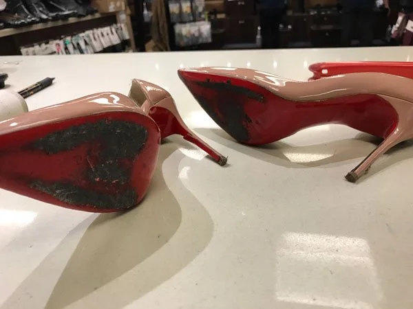 Christian Louboutin heels before repair close-up