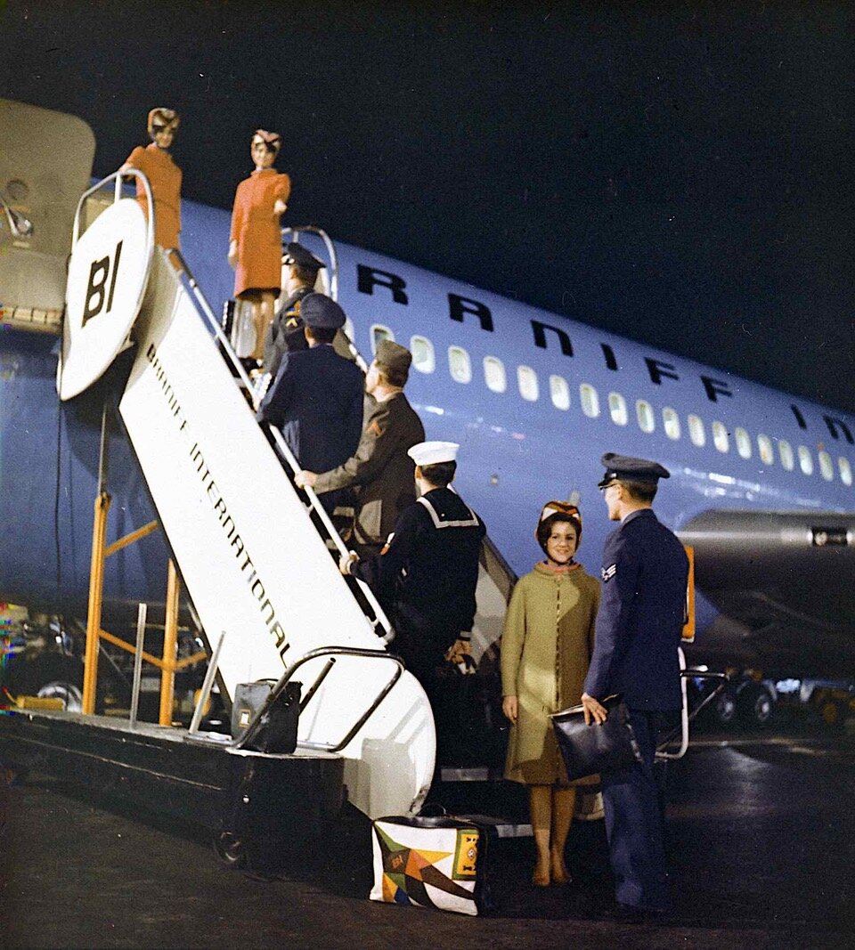 Military personnel boarding Braniff Boeing jet at Dallas Love Field in 1966