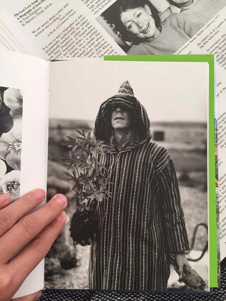 Joan Didion smiling at Derek Jarman and his dug-up hellebore. Why not.