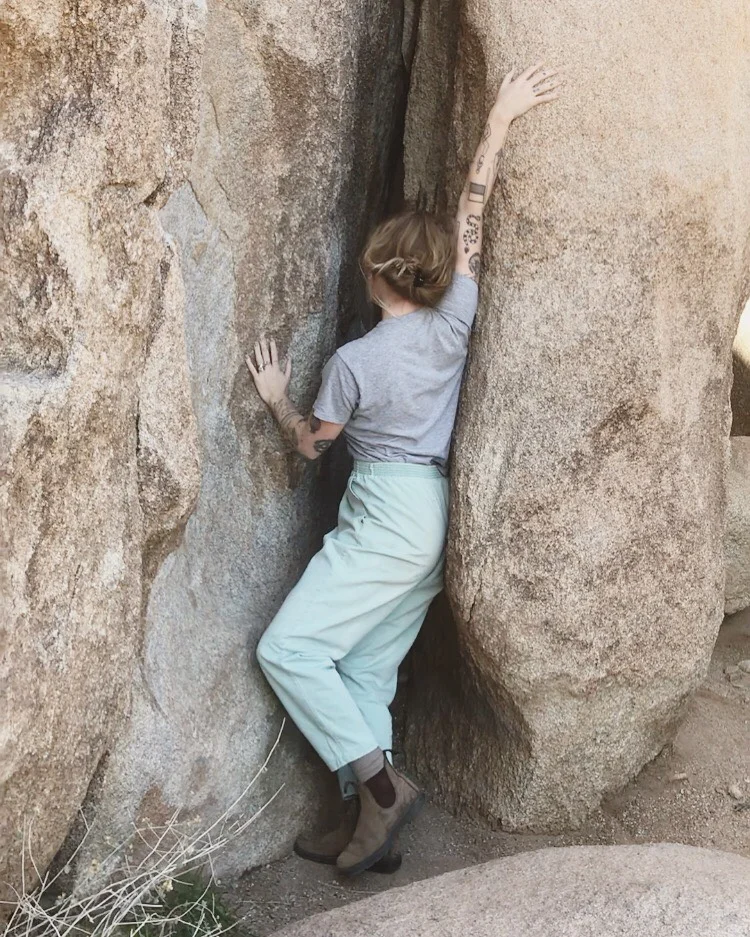 Climbing boulders in Joshua Tree