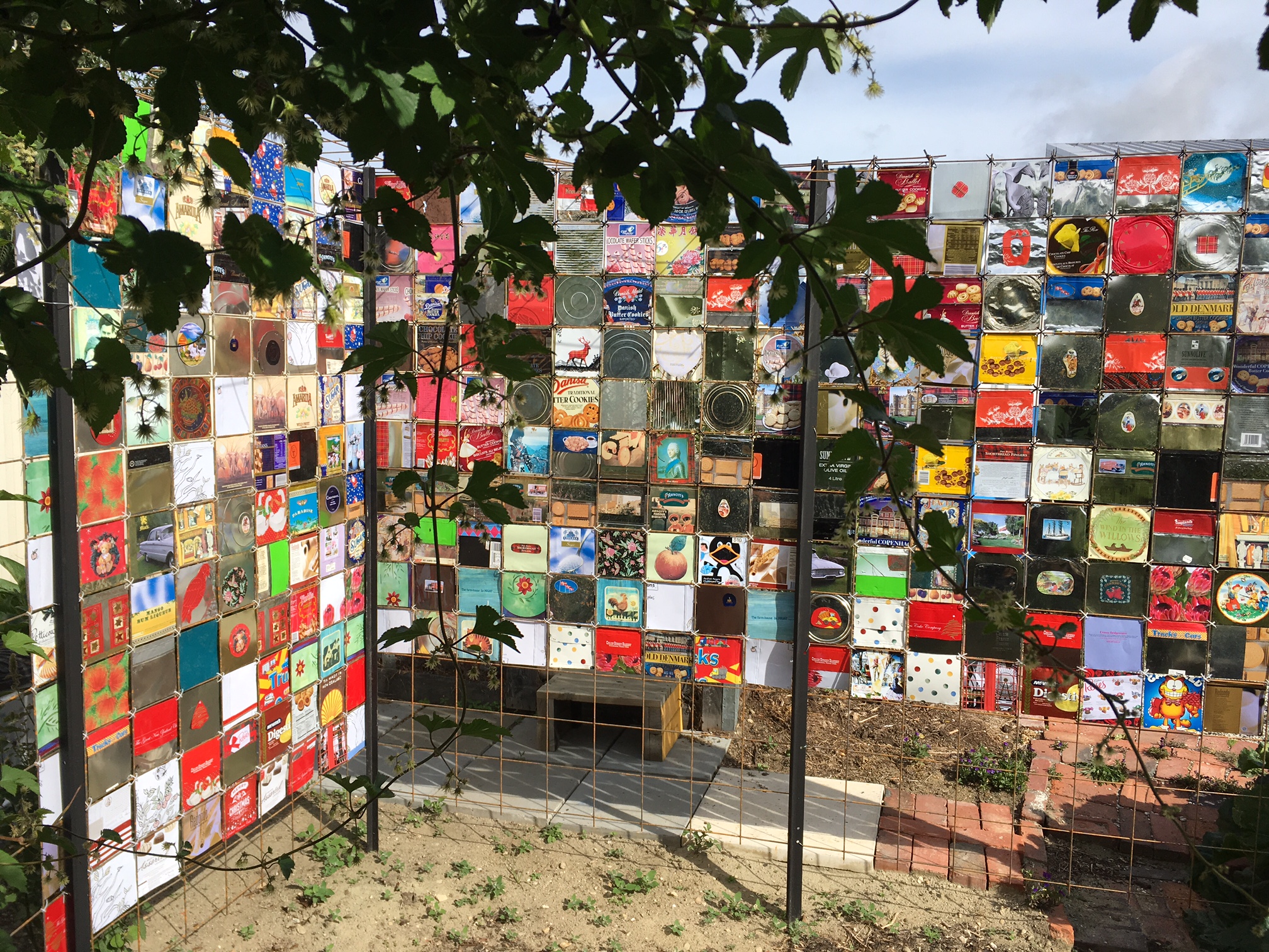 Wall made from biscuit tins for our yet to be completed outdoor seating area.