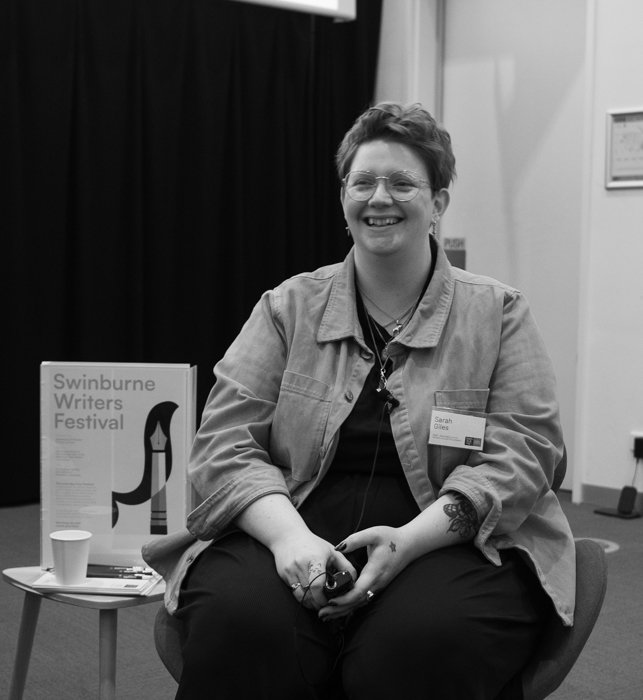 A photo of Sarah Giles smiling during a panel discussion for the twenty twenty five Swinburne Writers' Festival.