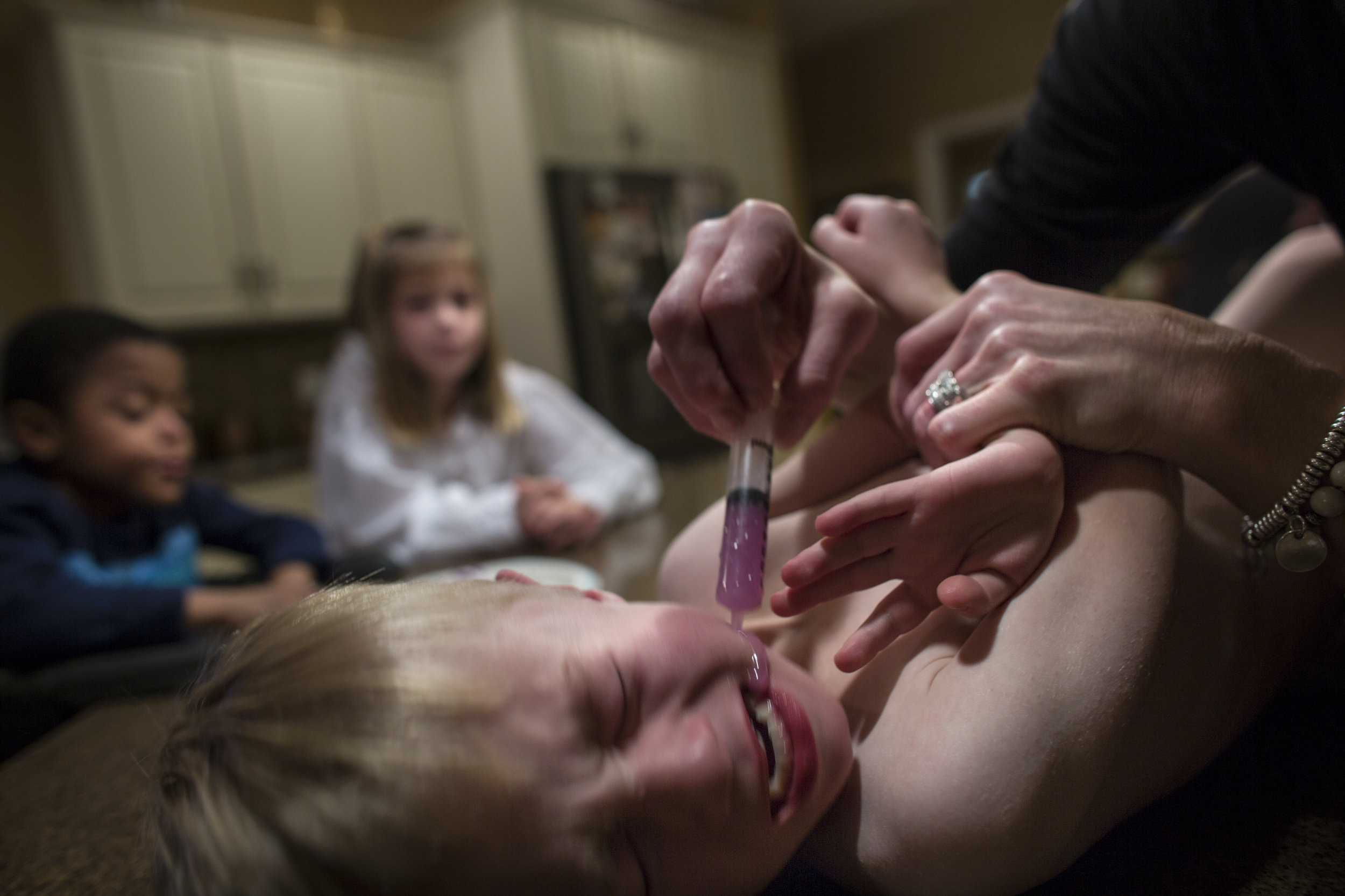  Sam (4) is fed a colored syrup via a syringe after his G-tube unplugged and was replaced. After replacement, colored liquid is ingested to confirm that the G-tube is properly connected. If a G-tube remains unplugged, the port can close within 30 min