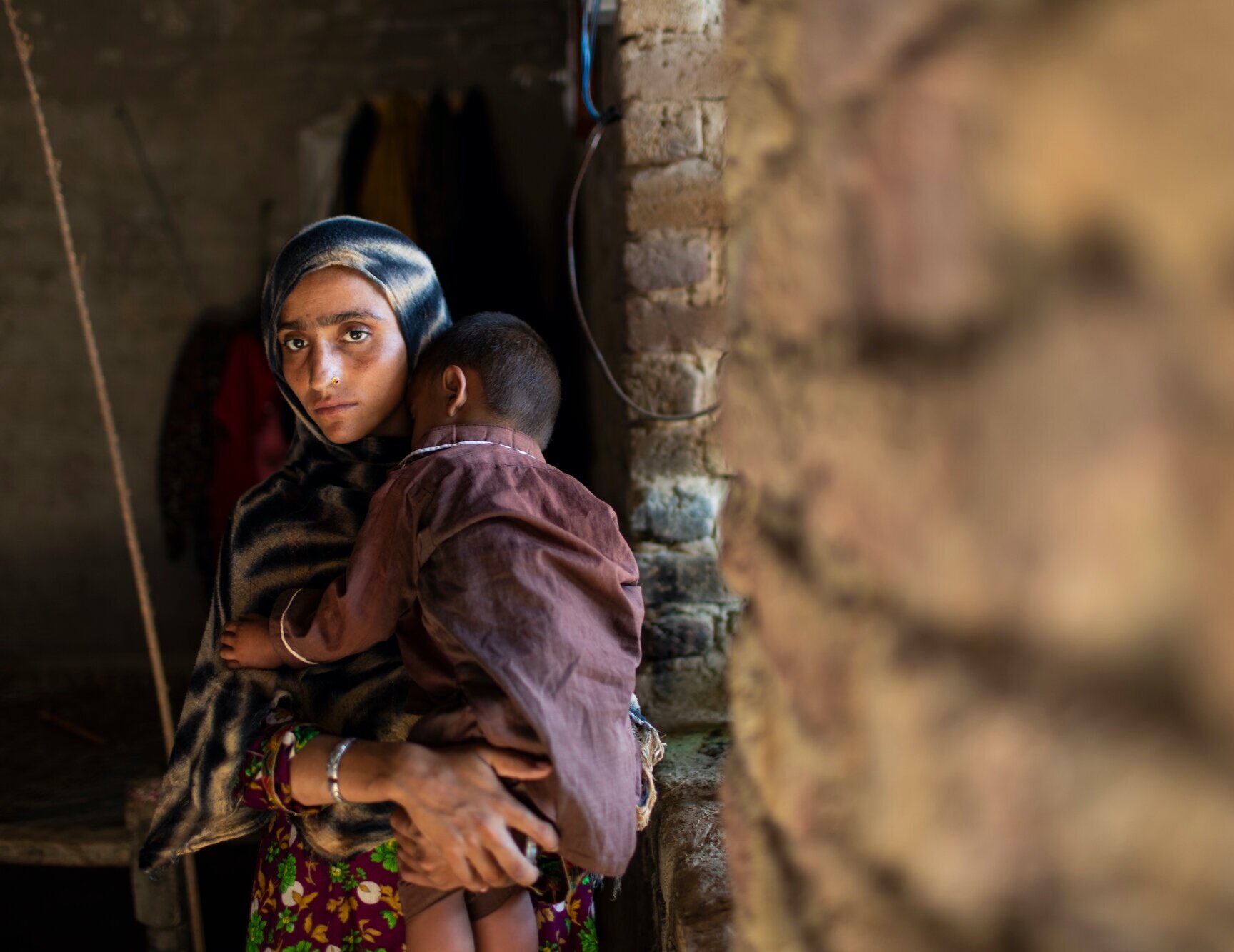  Bebi Sohrab, 22, with her son Hasan, 2, who both are HIV positive in their home in the Subhani Shar Village near Rato Dero. 