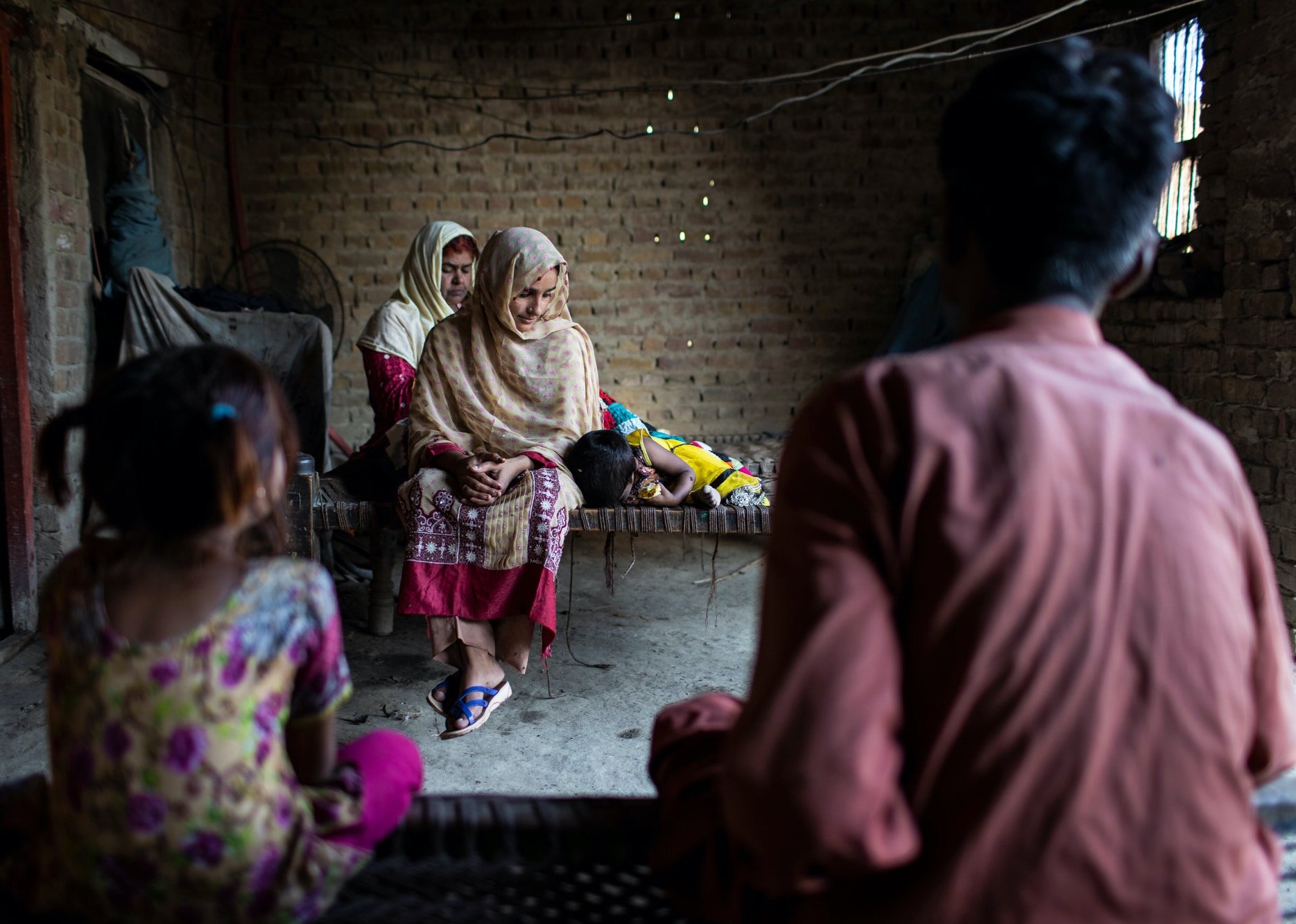 Parveen and her husband Tariq Hussain Seelro sit with their children at their home in Allah Dino Seelro village near Ratodero. Hussain was the first member of his family to test positive for HIV followed by his wife. There are a total of six family 