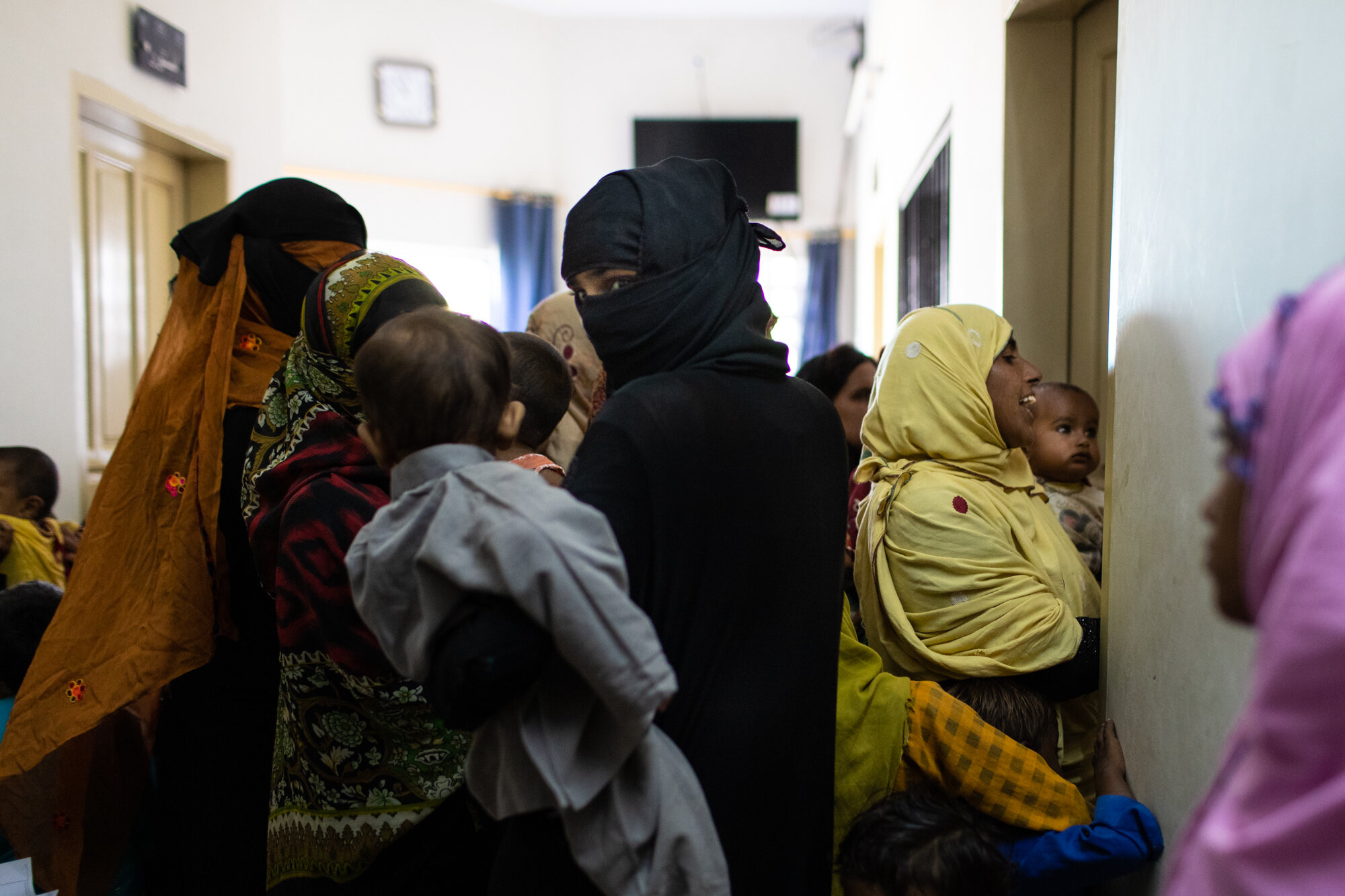  Mothers gather with their children outside a pediatricians office at a municipal clinic near Rato Dero on Oct 24, 2019. 