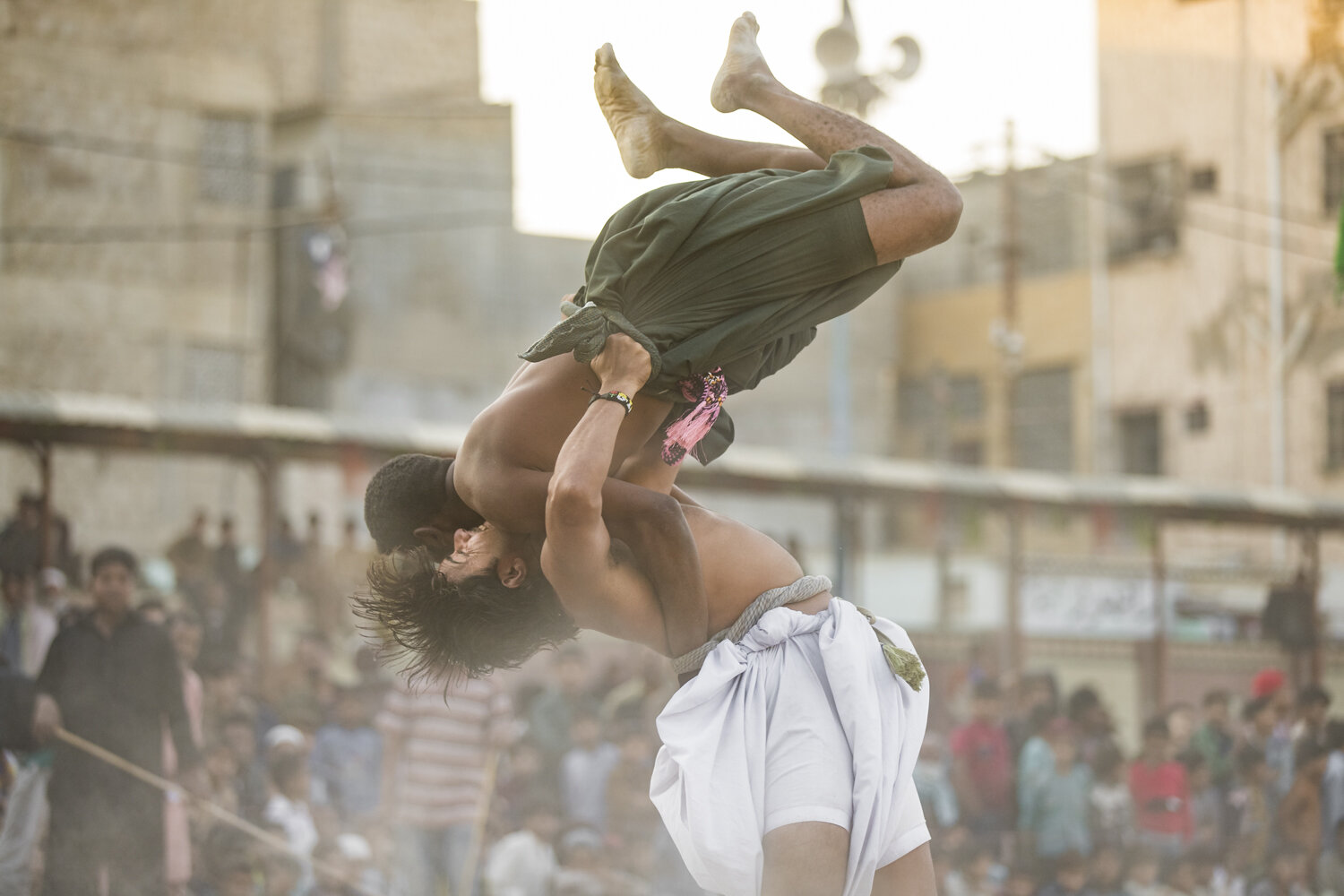  Malakhra ‘malhoos’ (wrestlers) grapple on the dirt grounds of Chanesar Blue Football Ground in Karachi, Pakistan on Dec 26, 2019. Malakhra is an age-old Sindhi wrestling sport practiced in Pakistan and India, dating back roughly 5000 years. Wrestler
