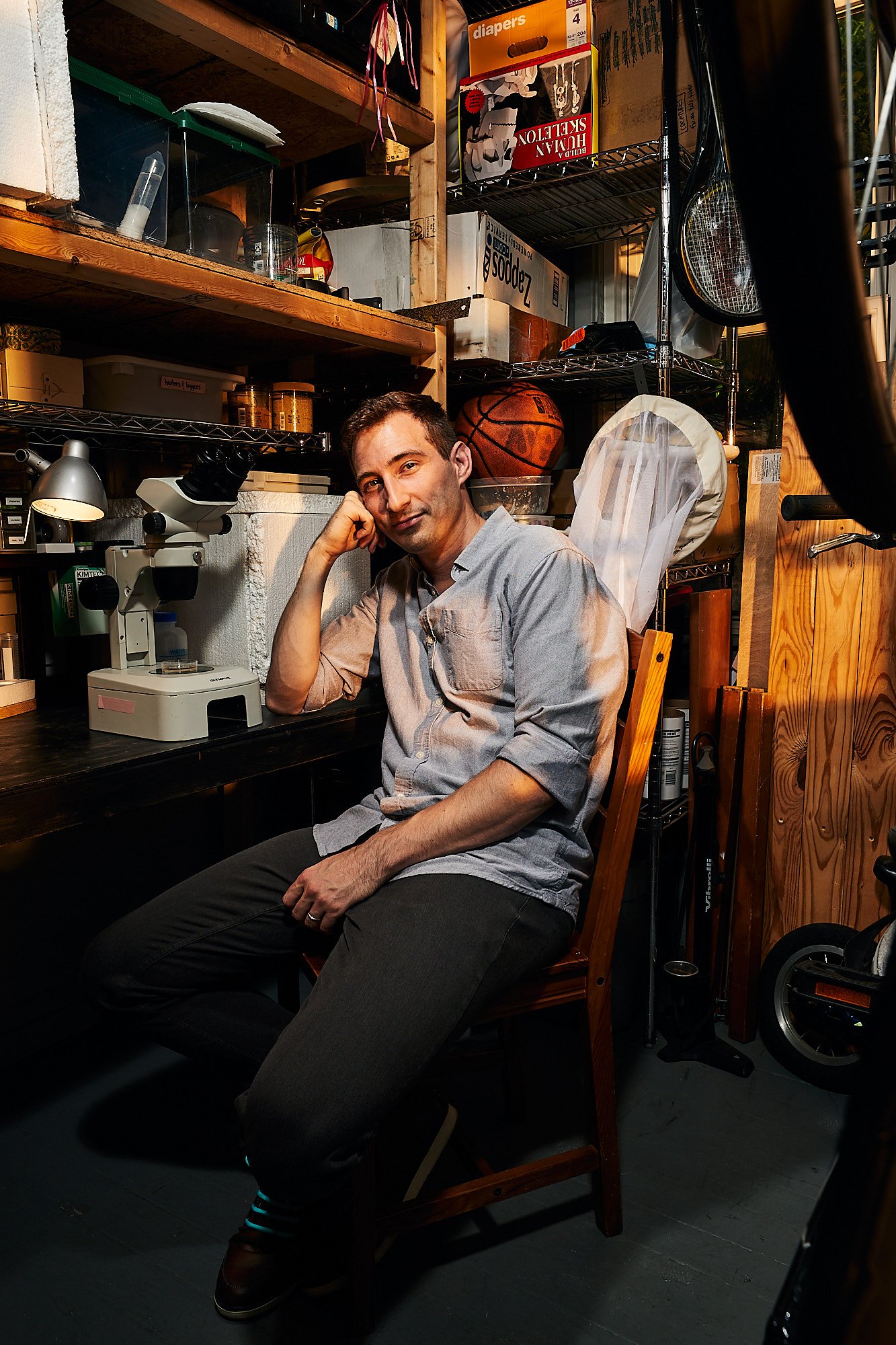  Dr. Seth Donoughe, postdoctoral fellow studying cricket embryonics at the University of Chicago, in his home lab in Chicago, I.L. on July 29, 2022.   (Mustafa Hussain for The New York Times)  
