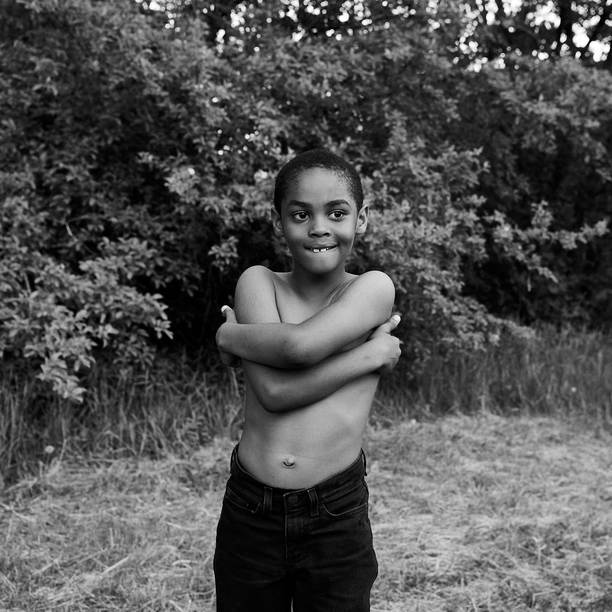  A week after the Buffalo Tops shooting, a young boy takes a break from playing football in the neighborhood of Cold Spring, near the Tops market on Jefferson Ave in Buffalo, N.Y. on May 21, 2022.  