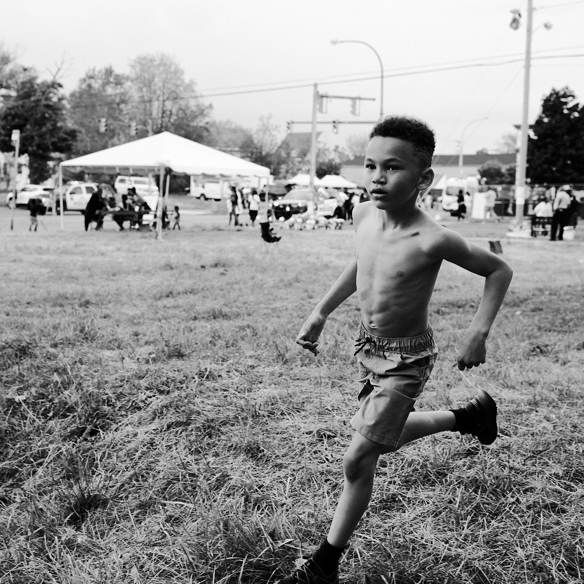   A week after the Buffalo Tops shooting, a young boy plays in the neighborhood of Cold Spring, near the Tops market on Jefferson Ave on in Buffalo, N.Y. on May 21, 2022.   