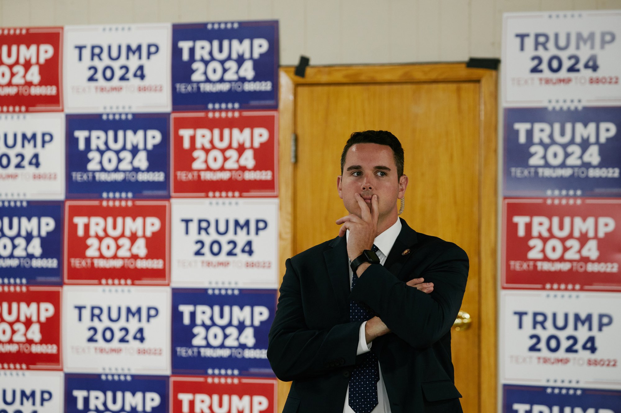  A secret service agent stands guard at the Team Trump Iowa Commit to Caucus Event at the Jackson County Fairgrounds in Maquoketa, IA on Sept. 20, 2023. (Mustafa Hussain for the New York Times) 