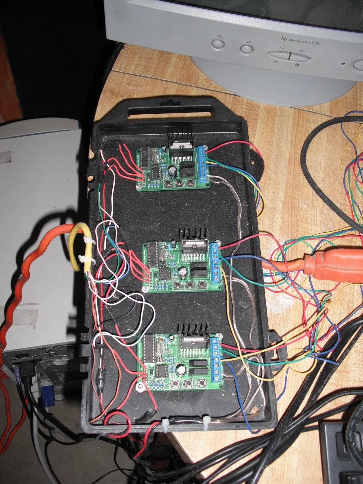 The stepper motor driver circuit. Notice the super fancy soldering iron case that is reused to hold the boards in place. 