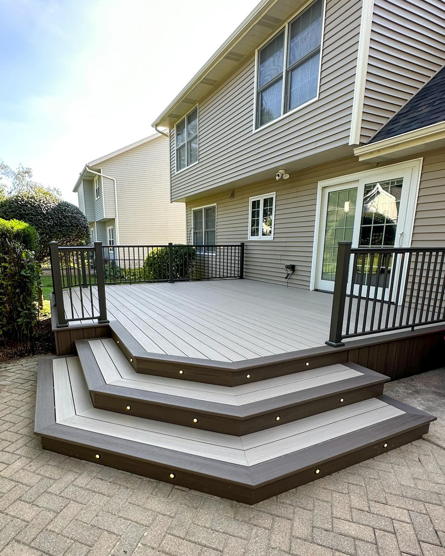 Ooh la la! Check out the facelift this deck received!

Since the existing framing was in good shape and our client liked the current layout of their deck we just resurfaced it with maintenance-free composite and updated the rail. Swipe all the way th