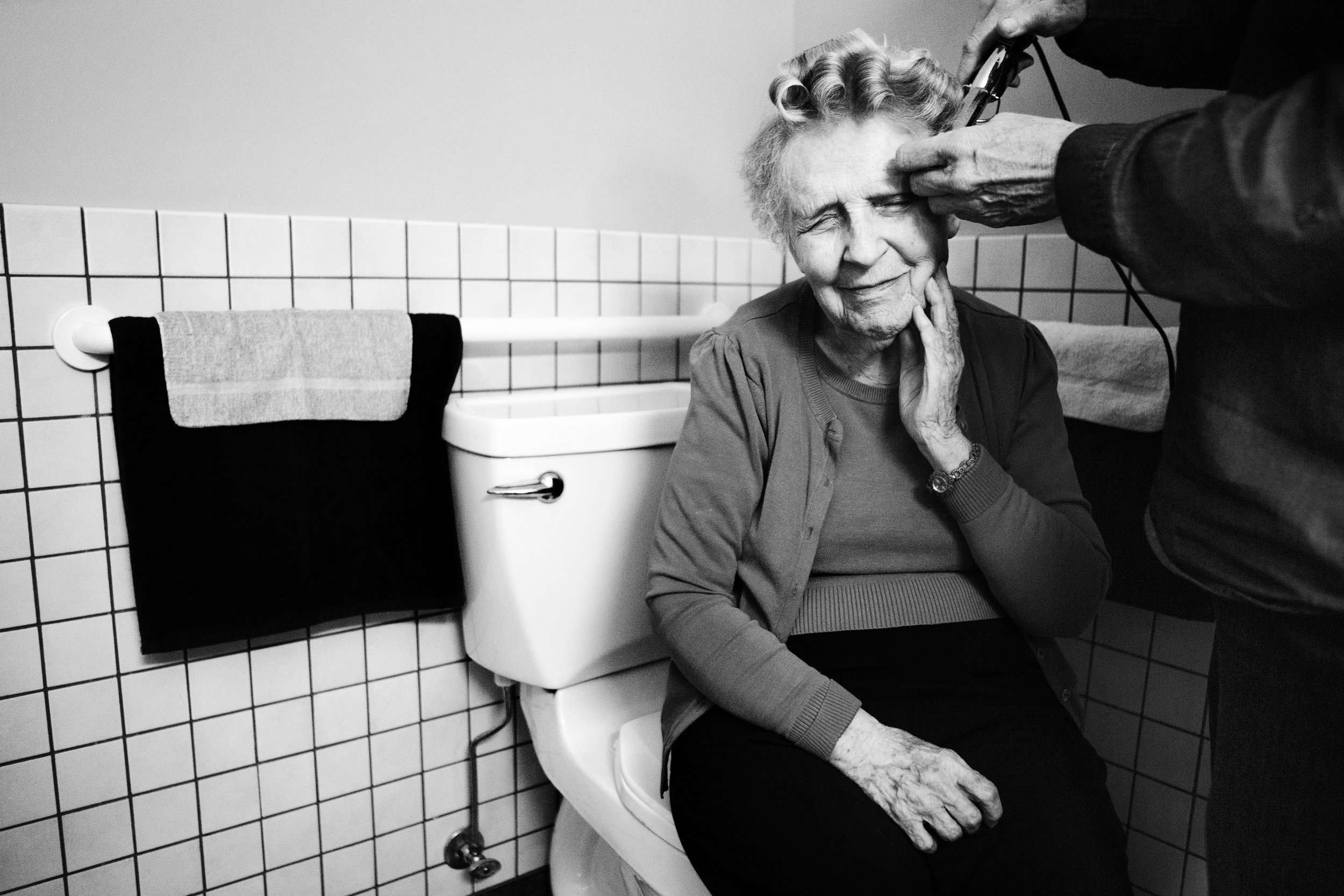 Eloise's caretaker curls her hair at least once a week. Since moving into the memory-care facility, Eloise now rarely styles her own hair or showers on her own. Still, she remembers her favorite hairstyle, the pageboy, which she had in college.