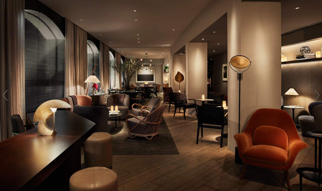 11 Howard, a trendy boutique hotel in Soho, combine textures and styles of furnishings for a truly eclectic, comfortable and unique vibe. Check out the contemporary chair in the forefront, surprisingly upholstered in the rich orange velvet! Combined with the wicker or bent wood chairs in the middle-ground and the tonal brown hues throughout, the space doesn’t feel “contemporary”… or tied to any specific time period. Image courtesy of 11howard.com/gallery