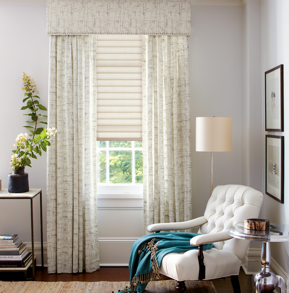 Straight cornice over pleated drapes and Hunter Douglas Sonnette® Cellular Roller Shades