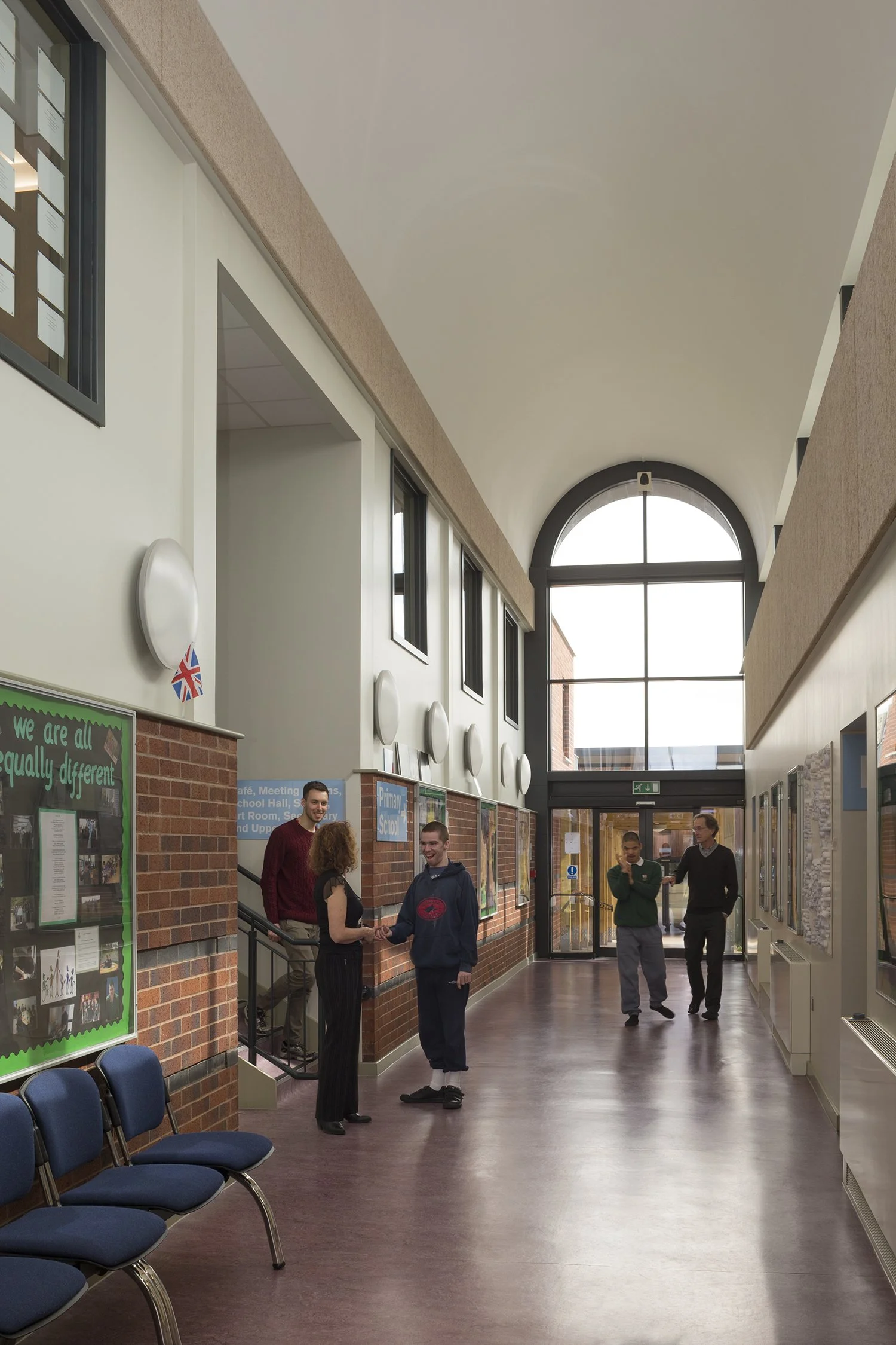 Light-filled central core interior at Rosehill School with clean-lined finishes and acoustic ceiling panels.