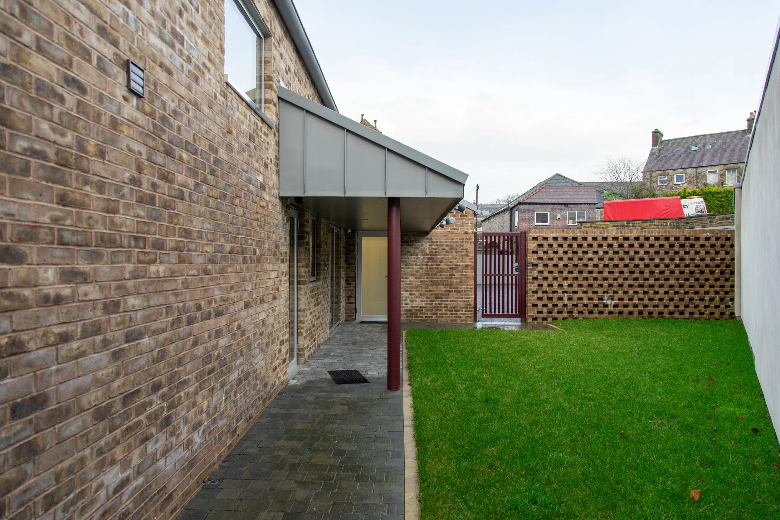 Rear elevation of Belfield House highlighting private walled garden and discreet high-level glazing