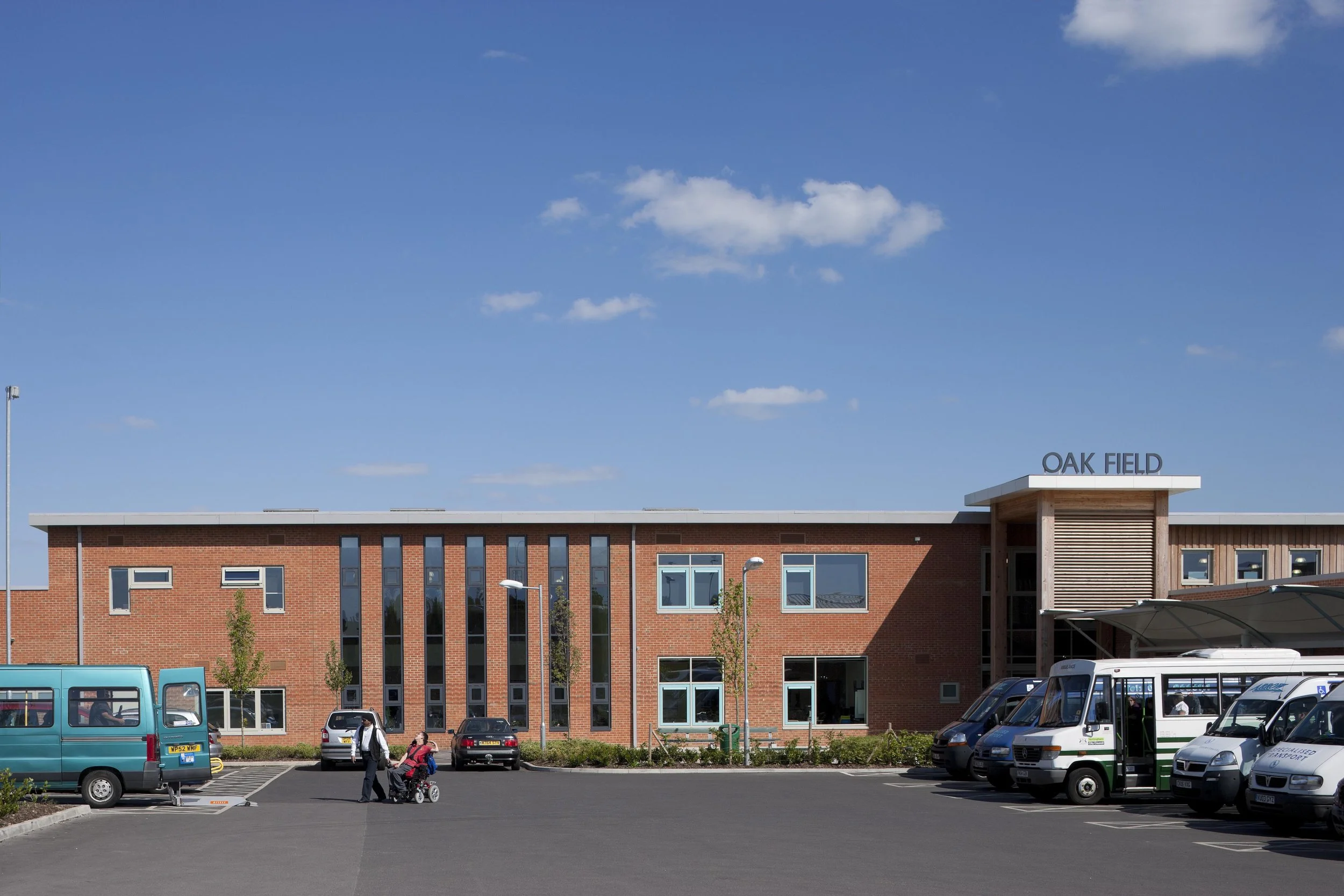 Main entrance forecourt at Oak Field School in Nottingham with clear wayfinding and accessible level threshold entry.