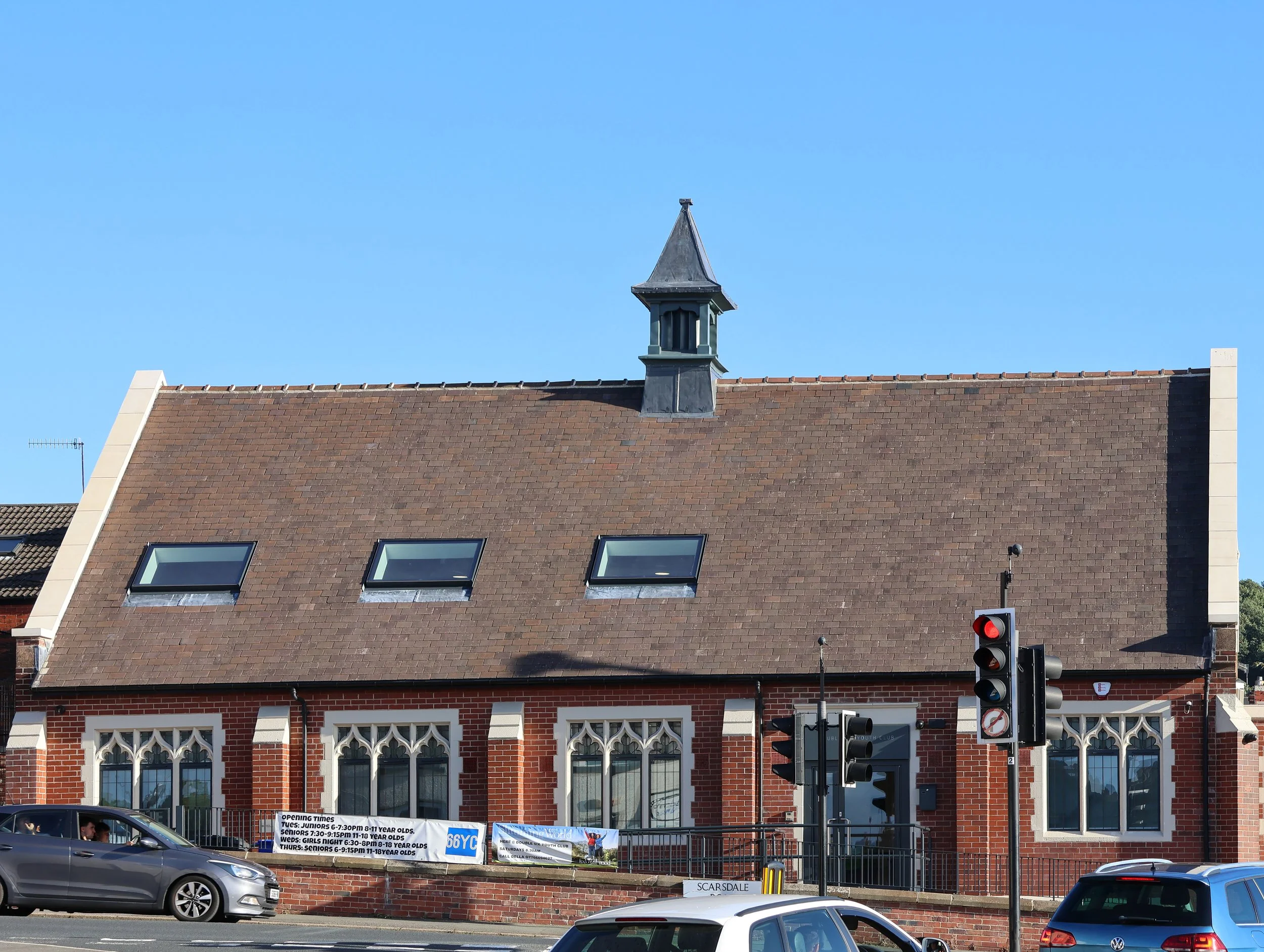 Exterior roof detail showing the re-slated pitched roof which included integrated flush south-facing solar PV panels and north-facing rooflights.