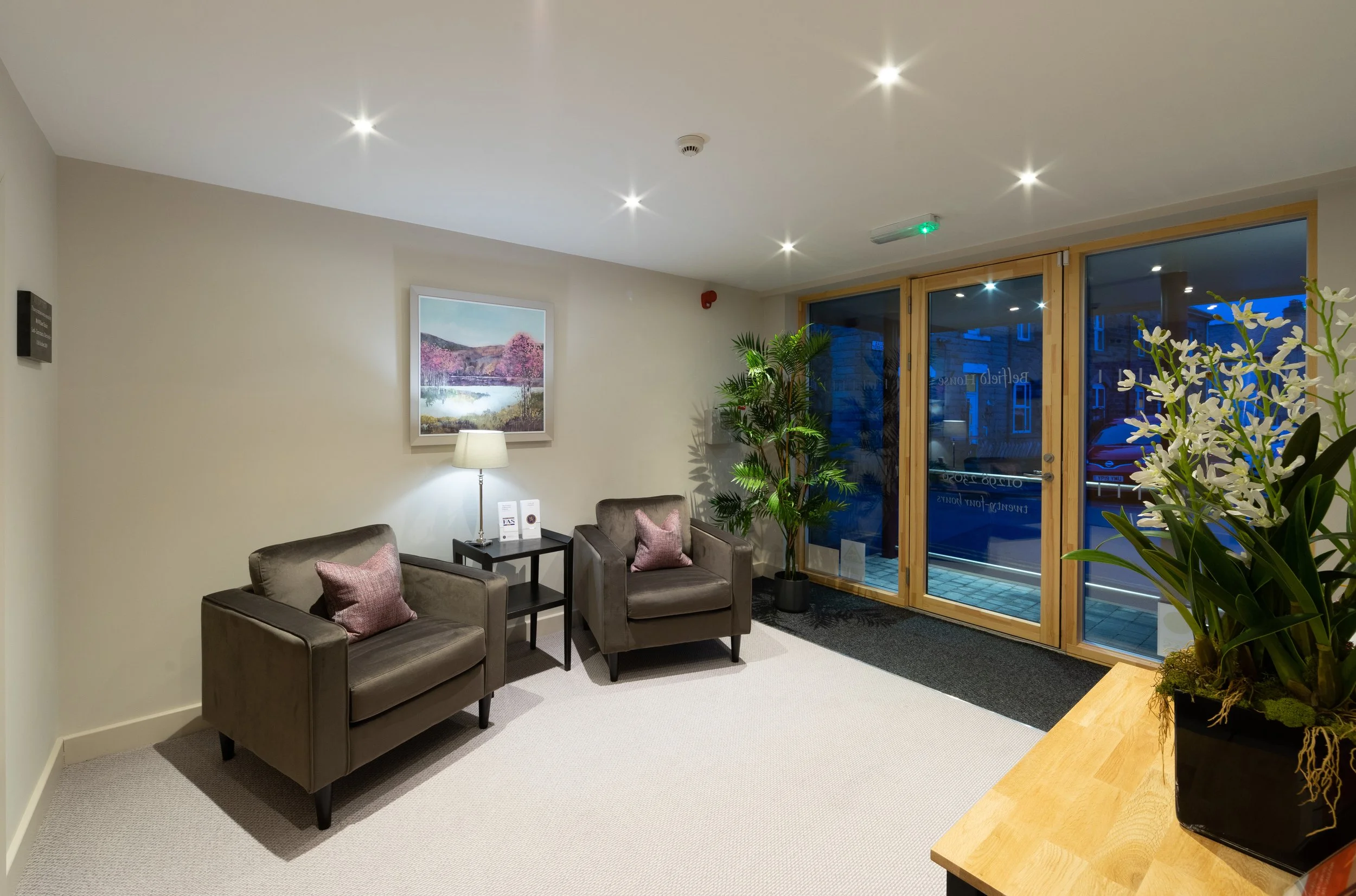 Detail view of main entrance canopy and level access reception at Belfield House funeral directors