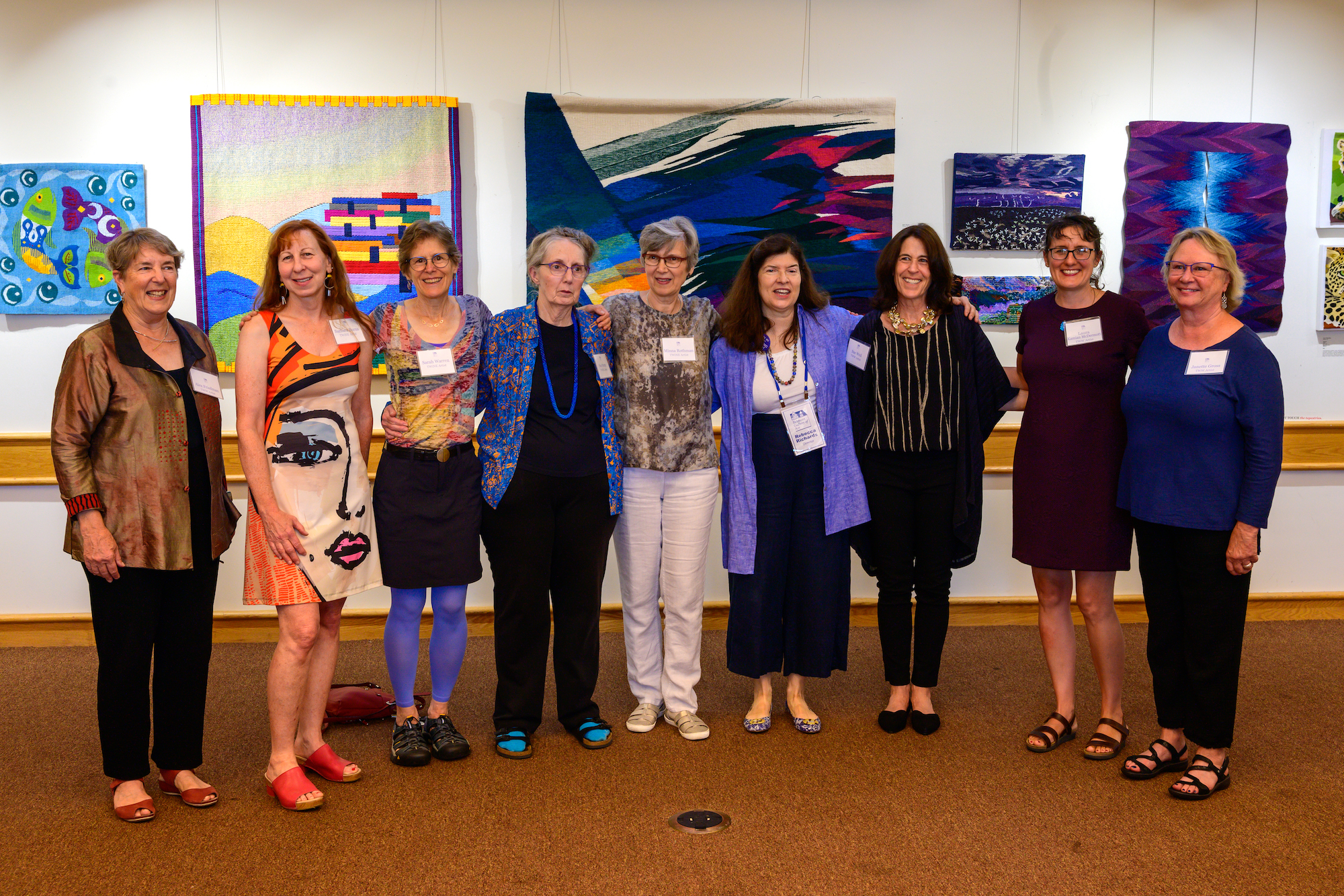 IMPACT artists at Belmont Gallery of Art opening reception, from left: Alex Friedman, Barbara Burns, Sarah Warren, Sue Pretty, Minna Rothman, Rebecca Richards (director of Belmont Gallery), Sue Weil, Laura Kamian McDermott, and Janette Gross. Photo by Michael Walsh.