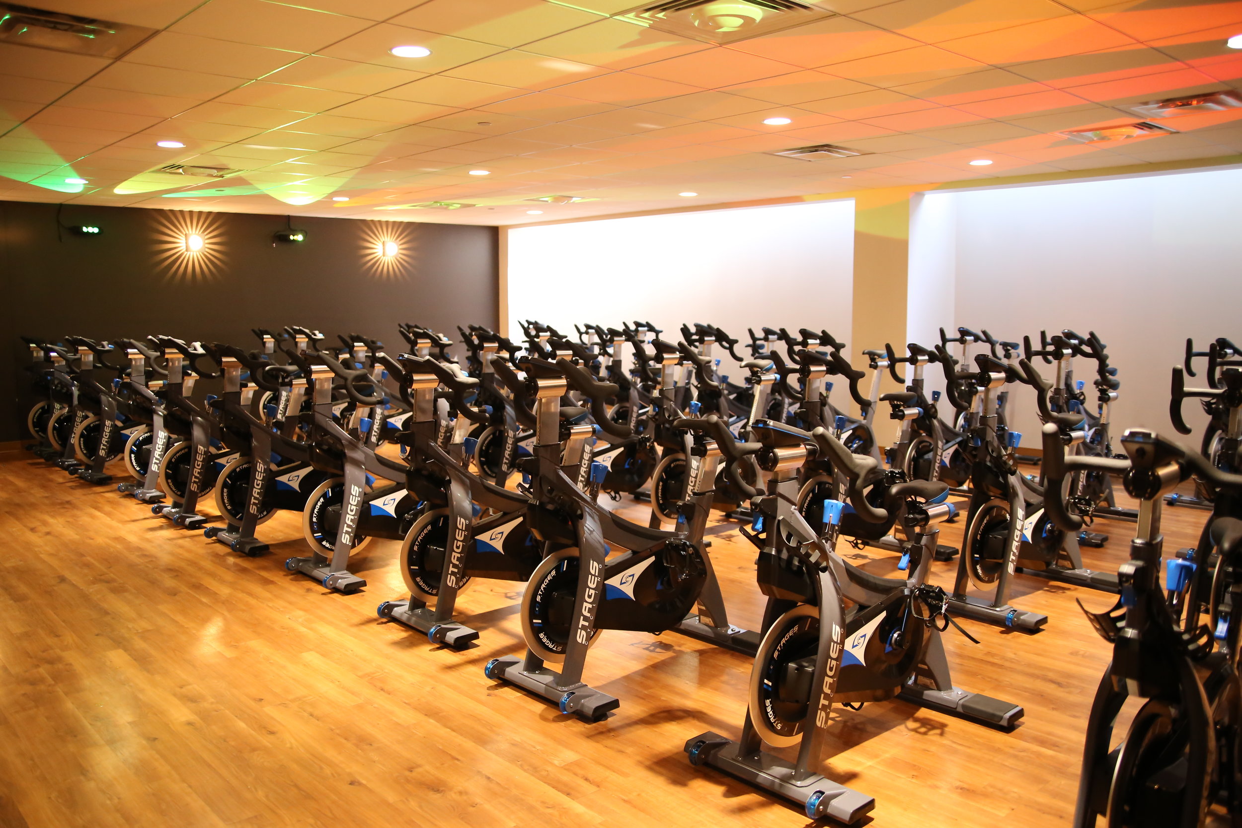Virtual and instructor led cycle classes are conveniently offered morning, afternoon and evening in the newly renovated Cycle Studio .