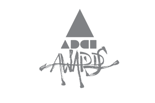 Graphic design with a triangle shape and the words 'Adci Awards' creatively stylized below it.