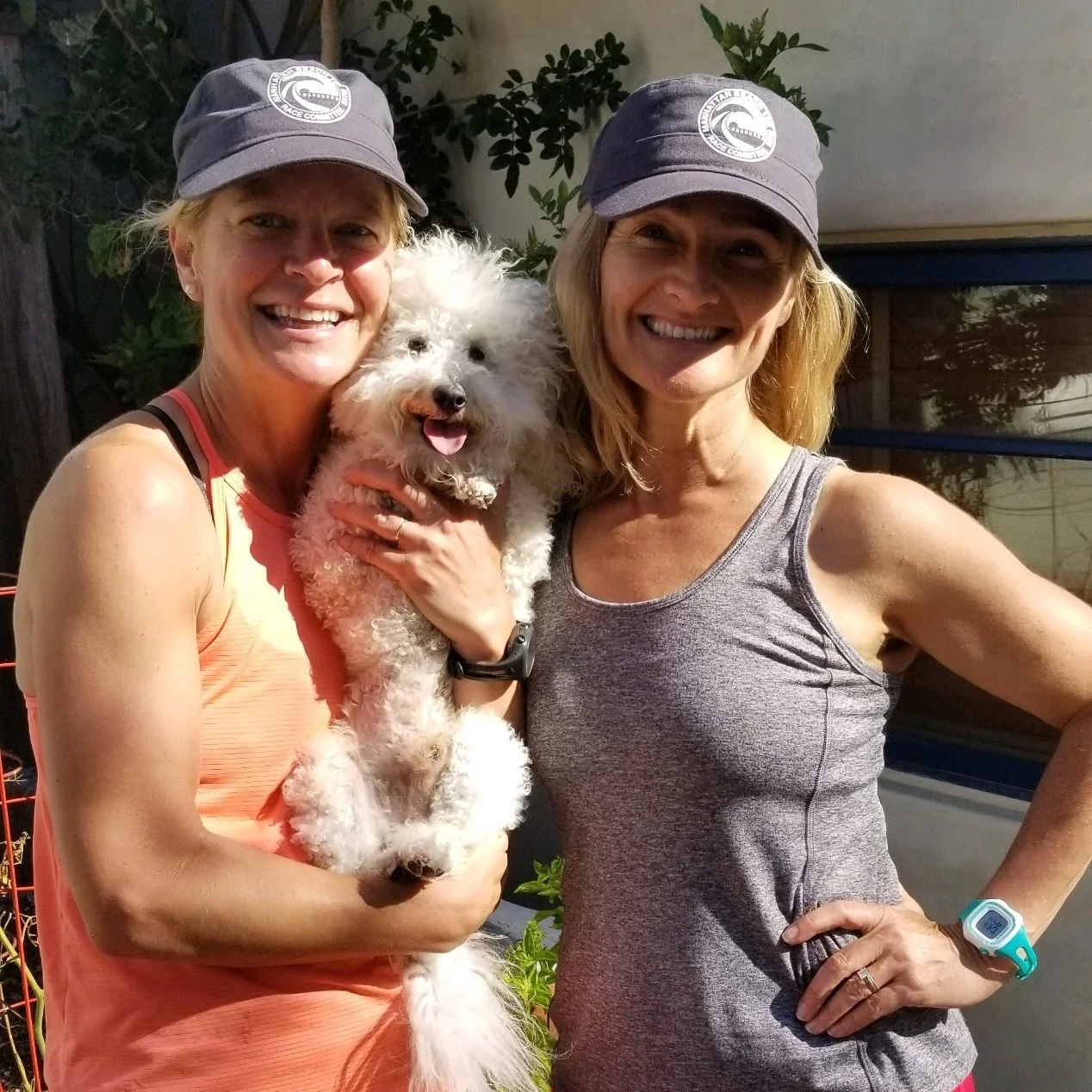 Race Director Rachel Judson with Tate the Adventure Poodle and Registration Director Annmarie Hext.