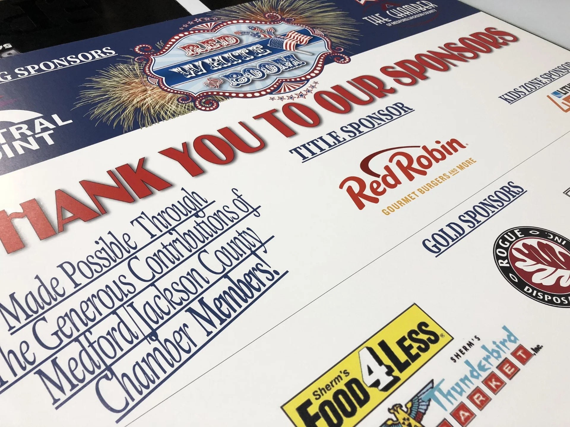 Red, white, and boom signs for the medford chamber of commerce