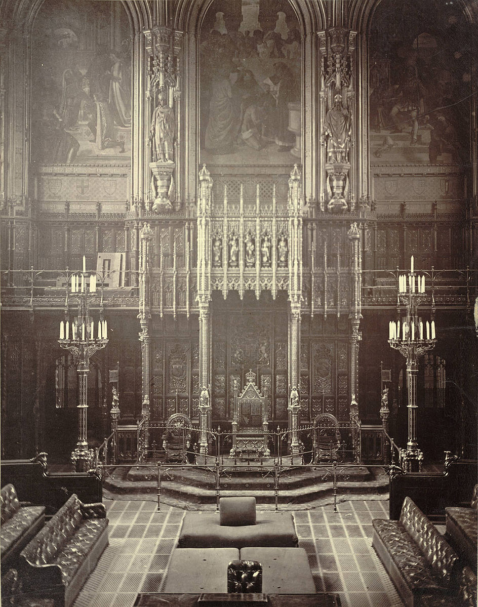  House of Lords, Westminster, c.1870-1885. The Woolsack (with back-rest) can be seen facing the throne in the upper foreground   Author: unknown  