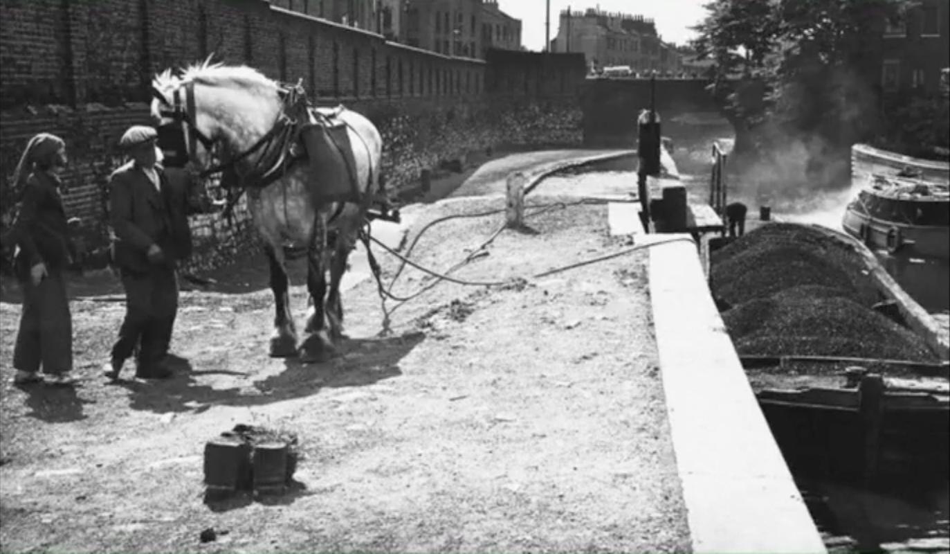 Trash barges in canal near Colin Greer's home in Bethnal Green