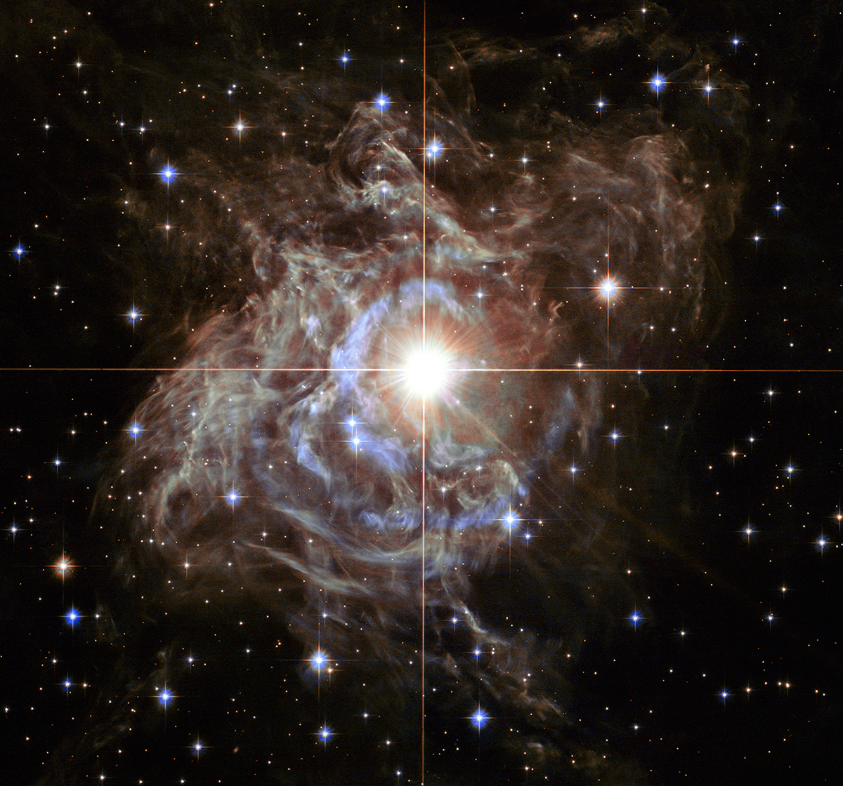 RS Puppis rhythmically brightens and dims over a six-week cycle. It is one of the most luminous in the class of so-called Cepheid variable stars. Its average intrinsic brightness is 15,000 times greater than our Sun’s luminosity. Image Credit: NASA, ESA, and the Hubble Heritage Team (STScI/AURA)-Hubble/Europe Collaboration