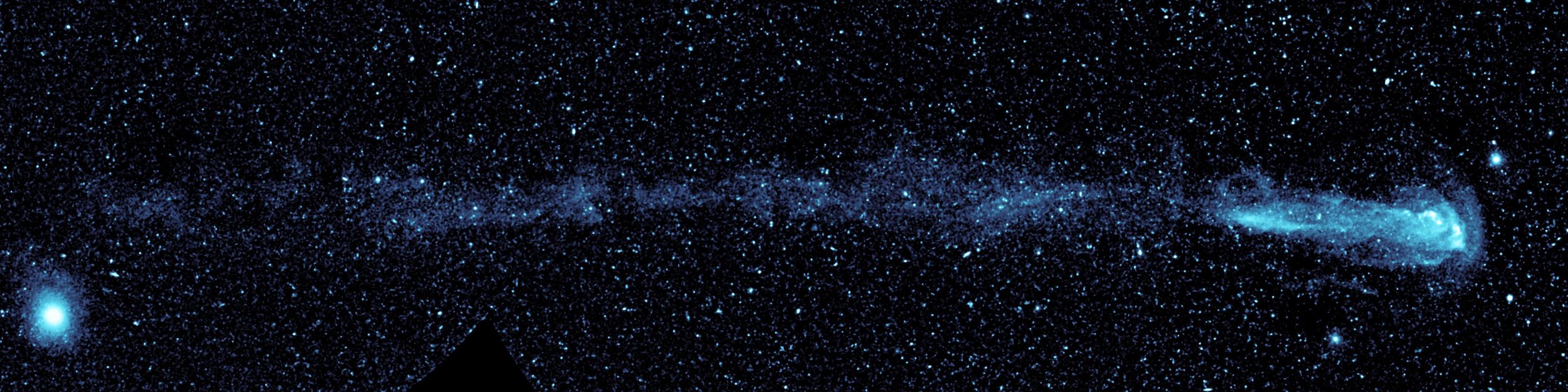 New ultraviolet images from NASA’s Galaxy Evolution Explorer shows a speeding star that is leaving an enormous trail of “seeds” for new solar systems. The star, named Mira (pronounced my-rah) after the latin word for “wonderful,” is shedding material that will be recycled into new stars, planets and possibly even life as it hurls through our galaxy. Mira, also known as Mira A, is not alone in its travels through space. It has a distant companion star called Mira B that is thought to be the burnt-out, dead core of a star, called a white dwarf. Mira A and B circle around each other slowly, making one orbit about every 500 years. Astronomers believe that Mira B has no effect on Mira’s tail. Image credit: NASA/JPL-Caltech